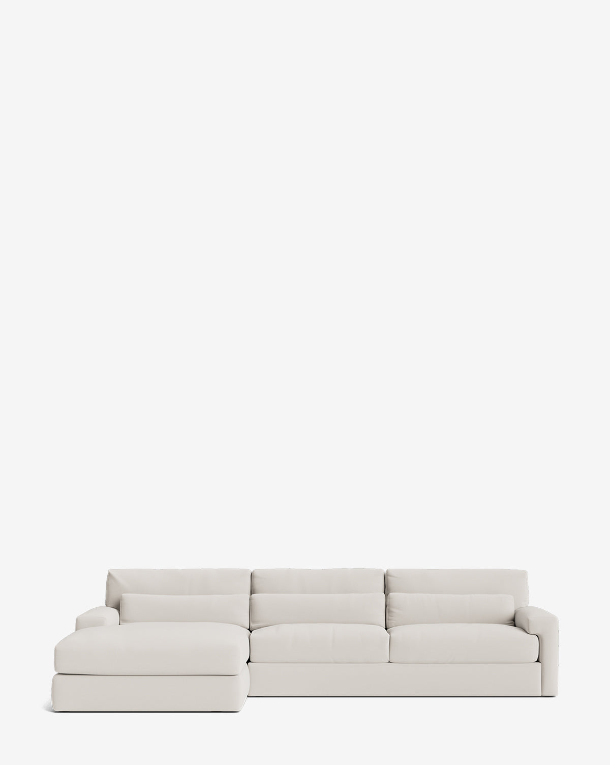 The Community Beckstead Chaise Sectional 128 is a modern, handcrafted light gray sofa with wide cushions and a left-side chaise lounge, shown against a plain white background. McGee & Co.