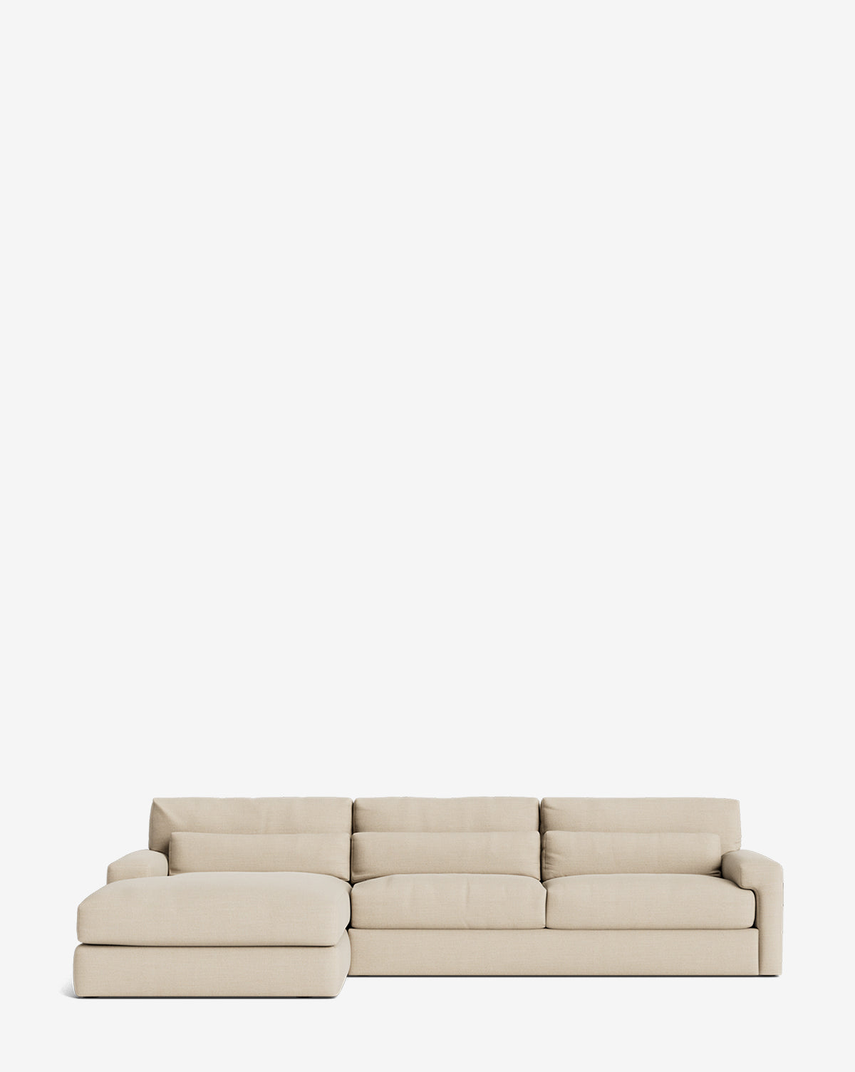 The Community Beckstead Chaise Sectional 128 features light beige upholstery, wide low-profile cushions, and a left chaise extension, shown against a plain white background. McGee & Co.