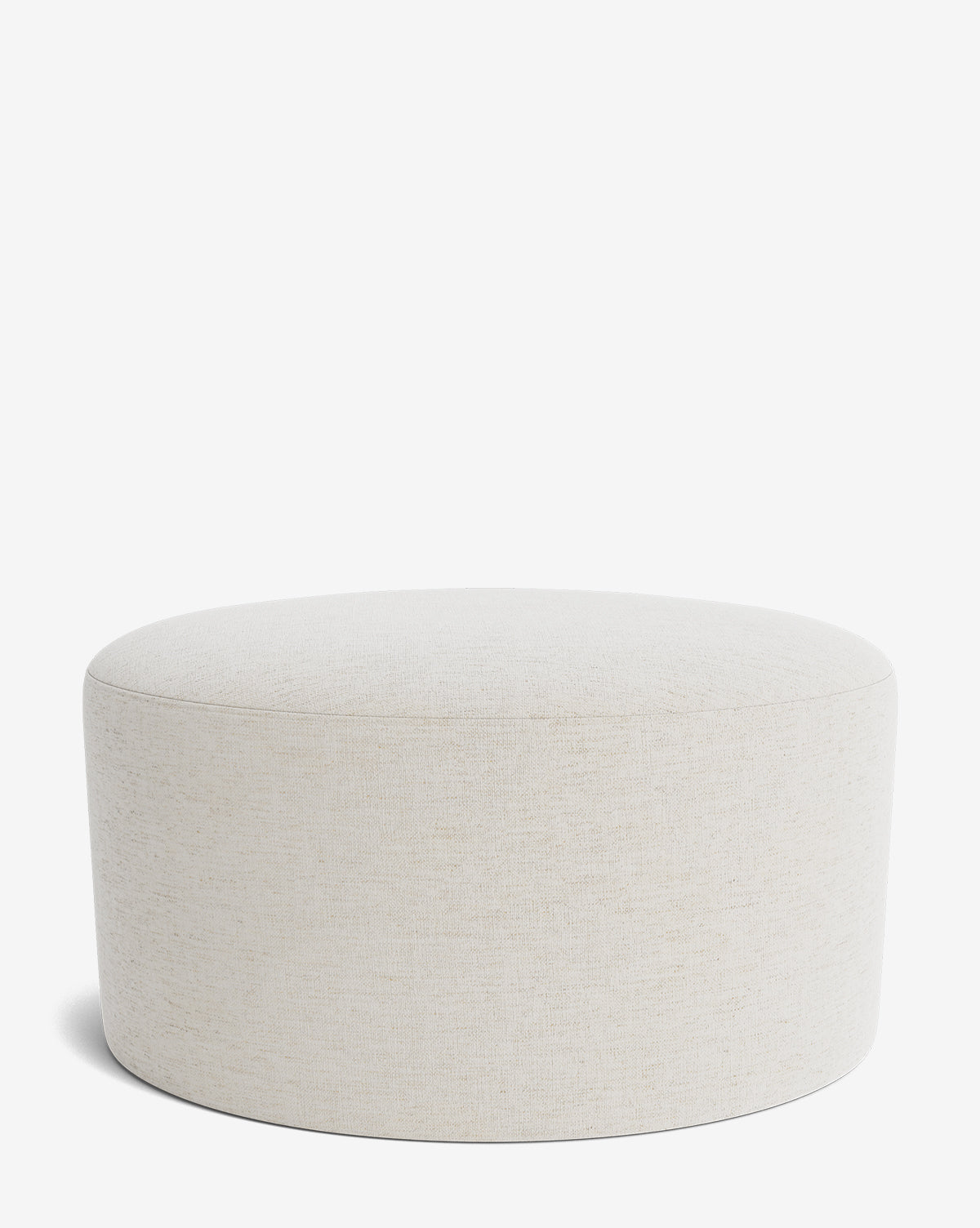 The Makerspalm Bellamy Ottoman is a simple, round piece in light beige fabric with a smooth surface and no visible legs or embellishments, shown against a plain white background. McGee & Co.