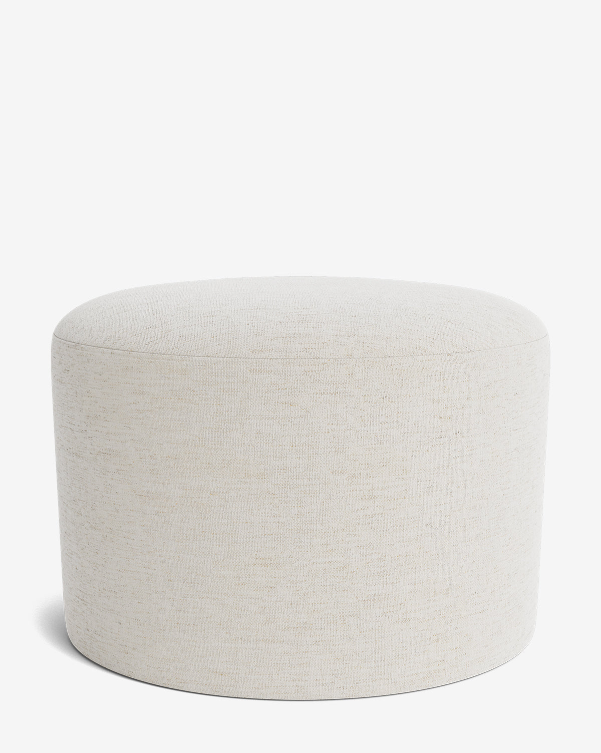 The Makerspalm Bellamy Ottoman is a round, light beige upholstered piece with a simple, modern design and smooth lines, set against a plain white background. McGee & Co.