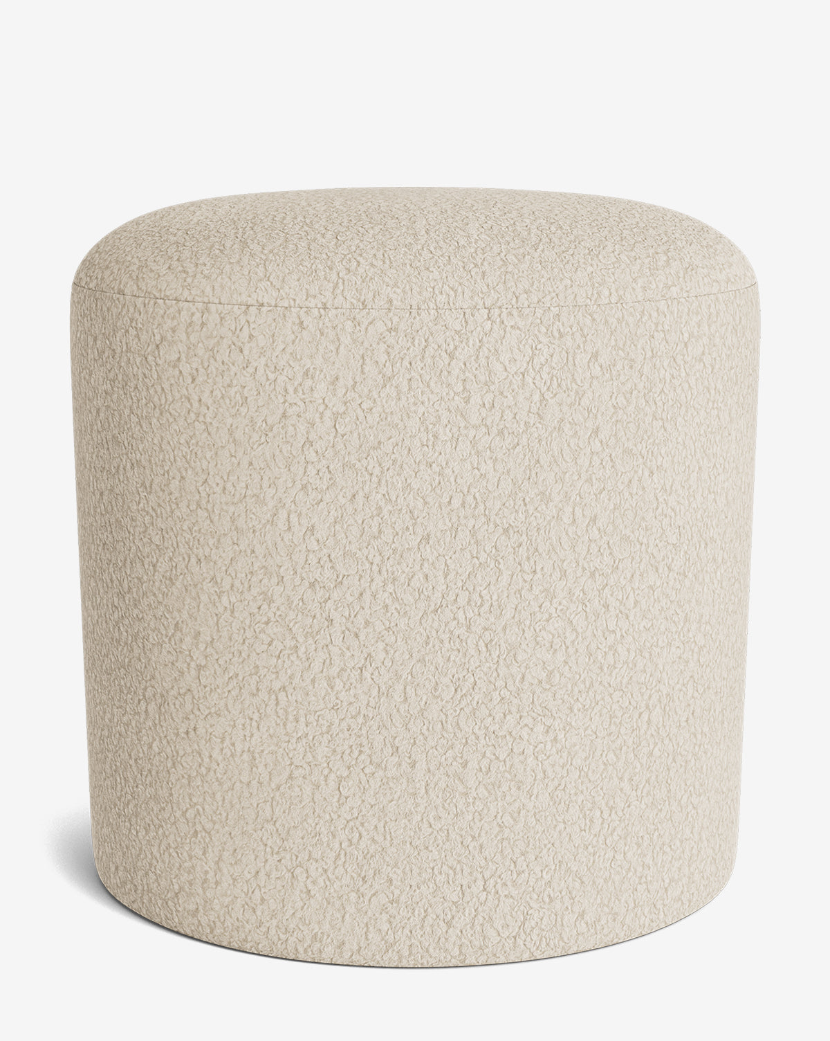 The Makerspalm Bellamy Ottoman is a round, beige ottoman with textured fabric, displayed on a white background. This versatile piece brings both style and function to any room. McGee & Co.
