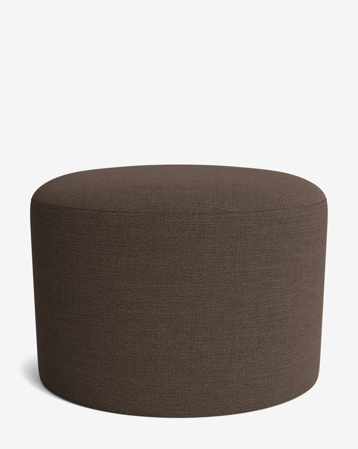 The Makerspalm Bellamy Ottoman showcases a round, brown upholstered fabric design, adding versatile style to any space. McGee & Co.