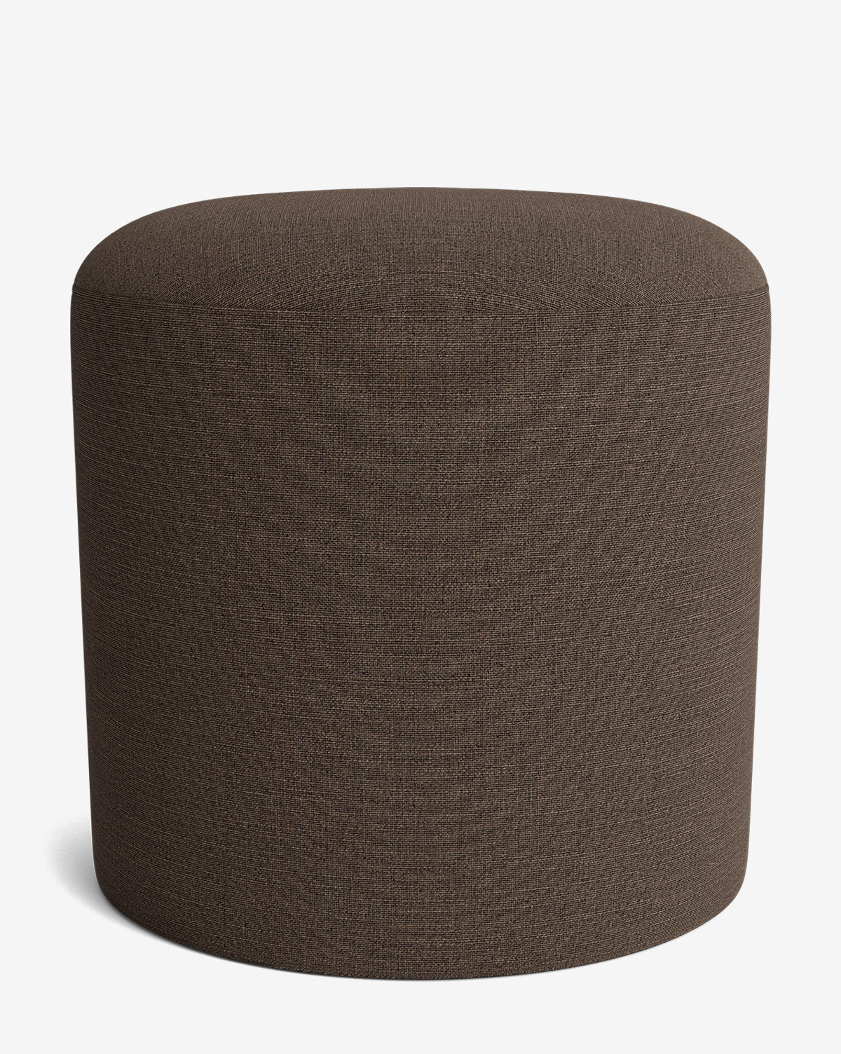 The Makerspalm Bellamy Ottoman is a simple, round piece with dark brown upholstery, a smooth seamless surface, and no visible legs or embellishments, shown against a plain white background. McGee & Co.