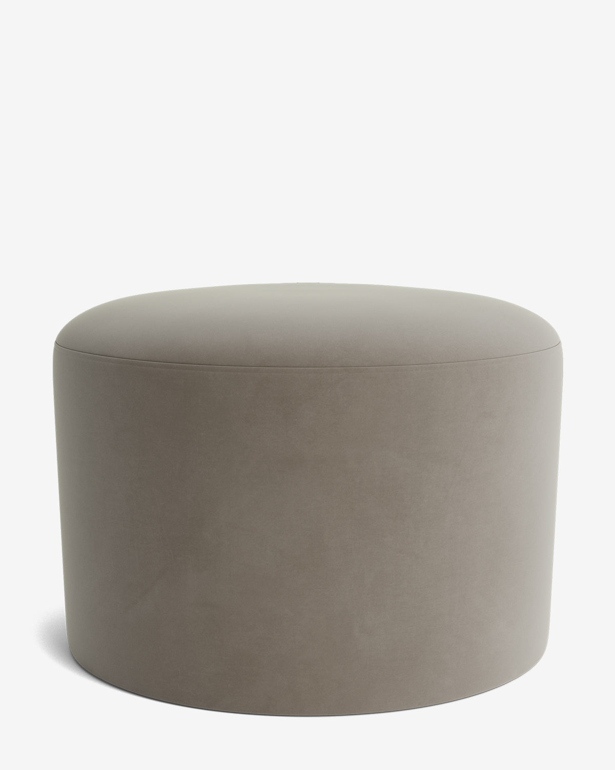 The Makerspalm Bellamy Ottoman is a round, taupe upholstered piece with a smooth, minimalist design, offering elegant versatility and functionality for any space. Shown here against a plain white background. McGee & Co.