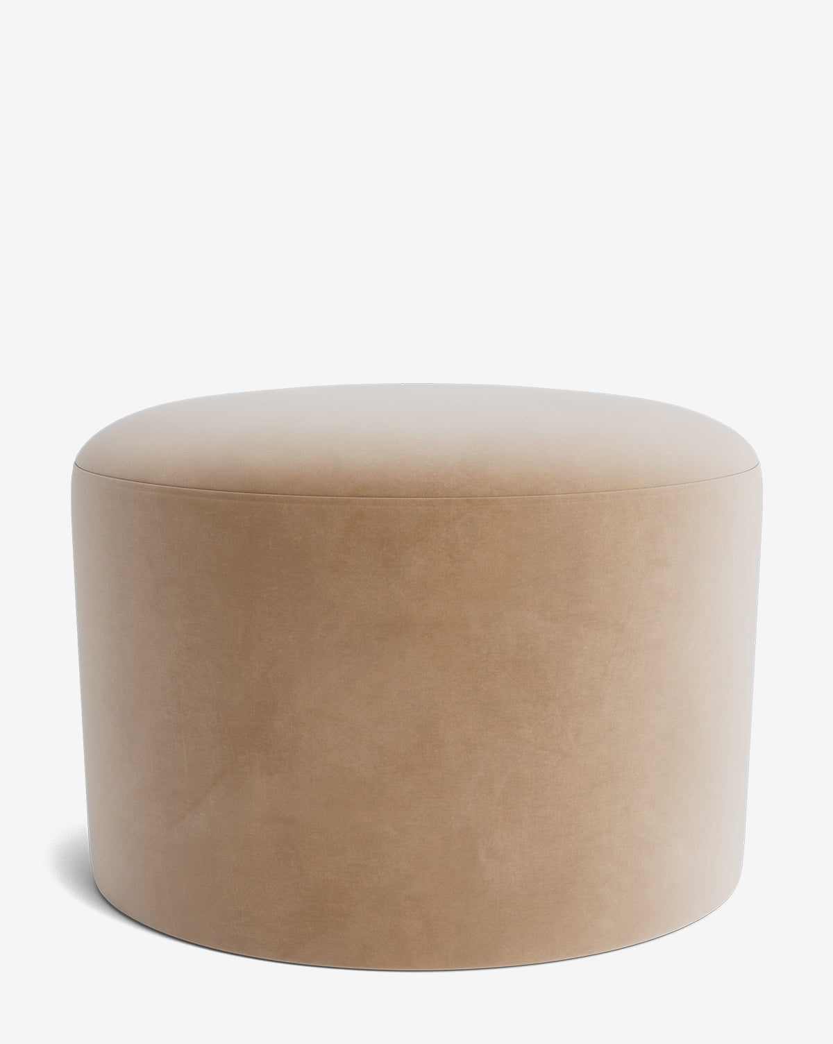 The Makerspalm Bellamy Ottoman is a round, beige ottoman with a smooth, upholstered surface and no visible legs, shown against a plain white background by McGee & Co.