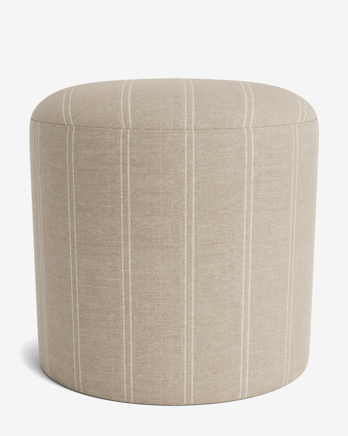 The Bellamy Ottoman by Makerspalm is a beige, round upholstered ottoman with subtle vertical white stripes, shown against a plain white background. This versatile piece adds elegance to any space. McGee & Co.