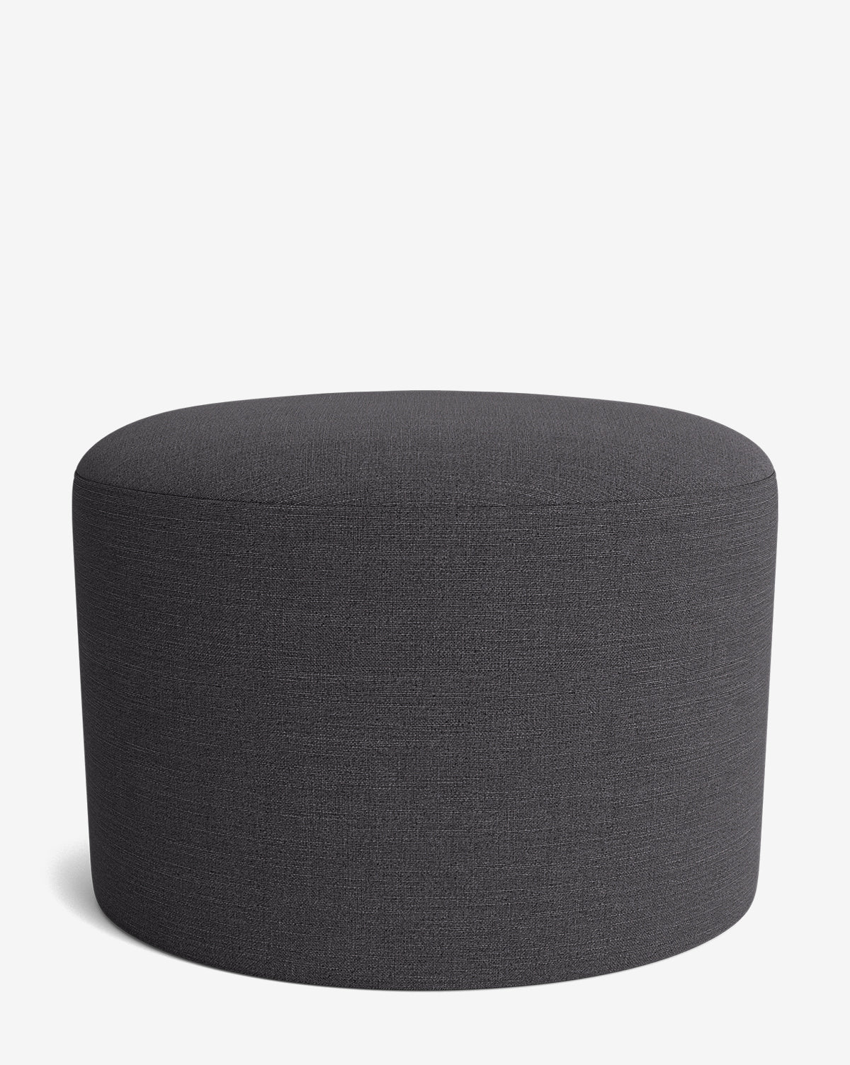 The Makerspalm Bellamy Ottoman features a round, dark gray fabric and minimalist design, displayed on a white background. Its versatile style perfectly complements any modern interior. McGee & Co.