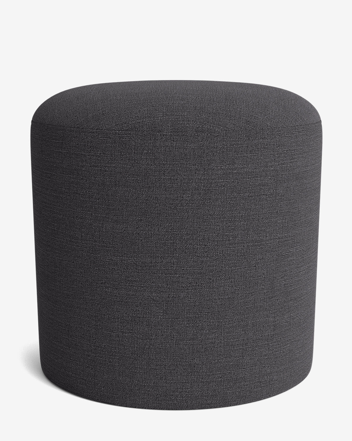 The Makerspalm Bellamy Ottoman features a simple, round design in dark gray with a smooth surface, set against a plain white background to highlight its versatile and understated elegance by McGee & Co.
