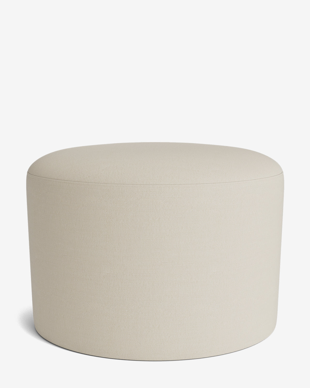 The Makerspalm Bellamy Ottoman is a round, beige ottoman with a smooth upholstered surface and no visible legs, shown on a plain white background. This stylish piece adds versatile comfort to any room by McGee & Co.