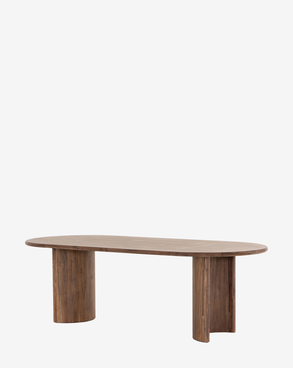 The Belvedere Dining Table features a modern solid wood design with an oval top and two cylindrical pedestal legs, shown against a plain white background by McGee & Co.