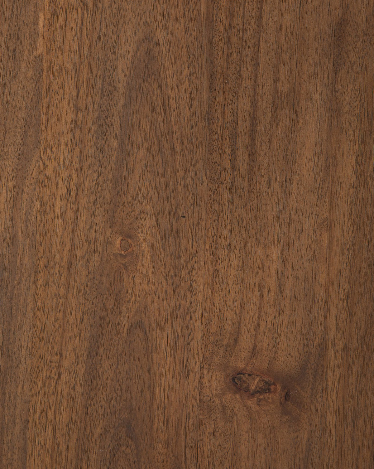 Close-up of the Belvedere Dining Table’s acacia wood surface shows a natural brown color with visible grain and knots, highlighting the detailed pattern and suggesting an unfinished or lightly finished look, by McGee & Co.