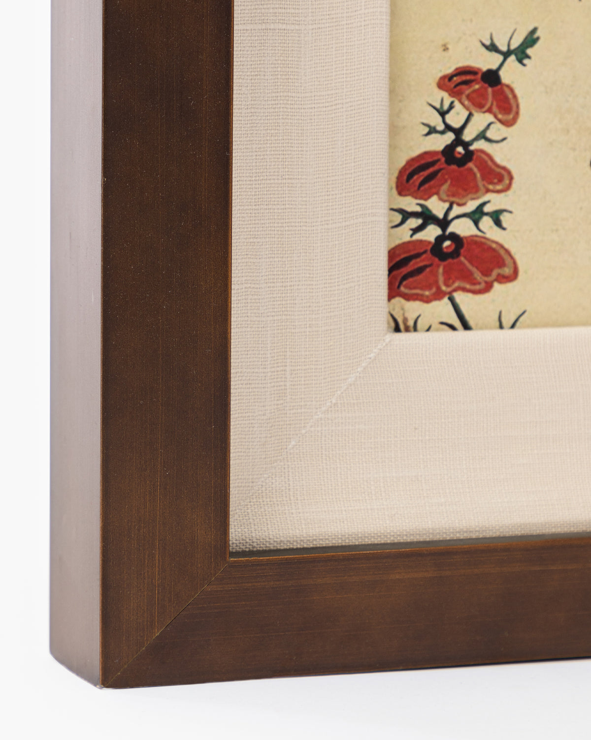Close-up of Berries & Leaves: a wooden picture frame with a beige fabric mat surrounds giclee print artwork featuring red and black floral designs in the corner.