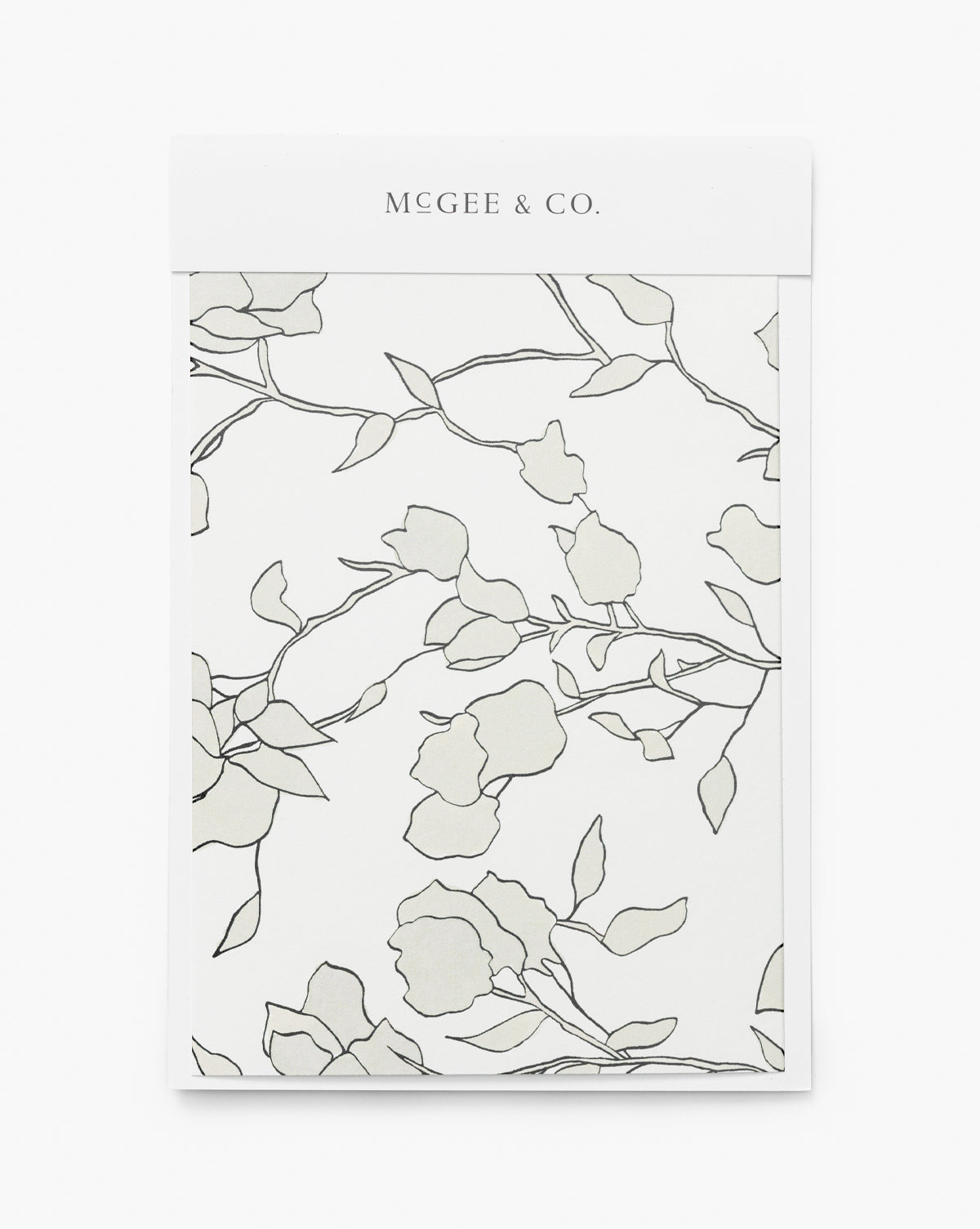A wallpaper swatch from York Wallcoverings called Blair Sketched Floral features a white background with minimalist floral line drawings of branches and flowers in light gray and black, inspired by neutral, modern design, McGee & Co.