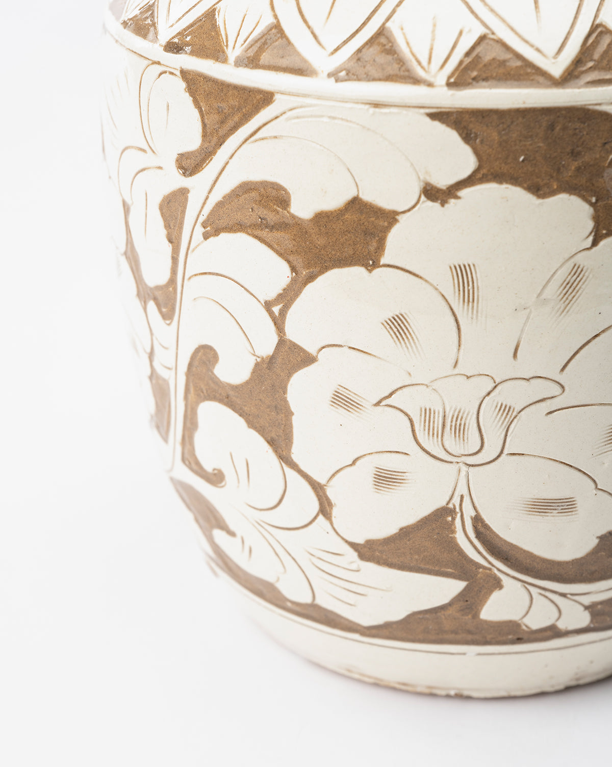 Close-up of the Blaise Vase, a handmade piece in cream and brown with large, intricately etched floral and leaf designs—perfect as timeless home decor, by McGee & Co.