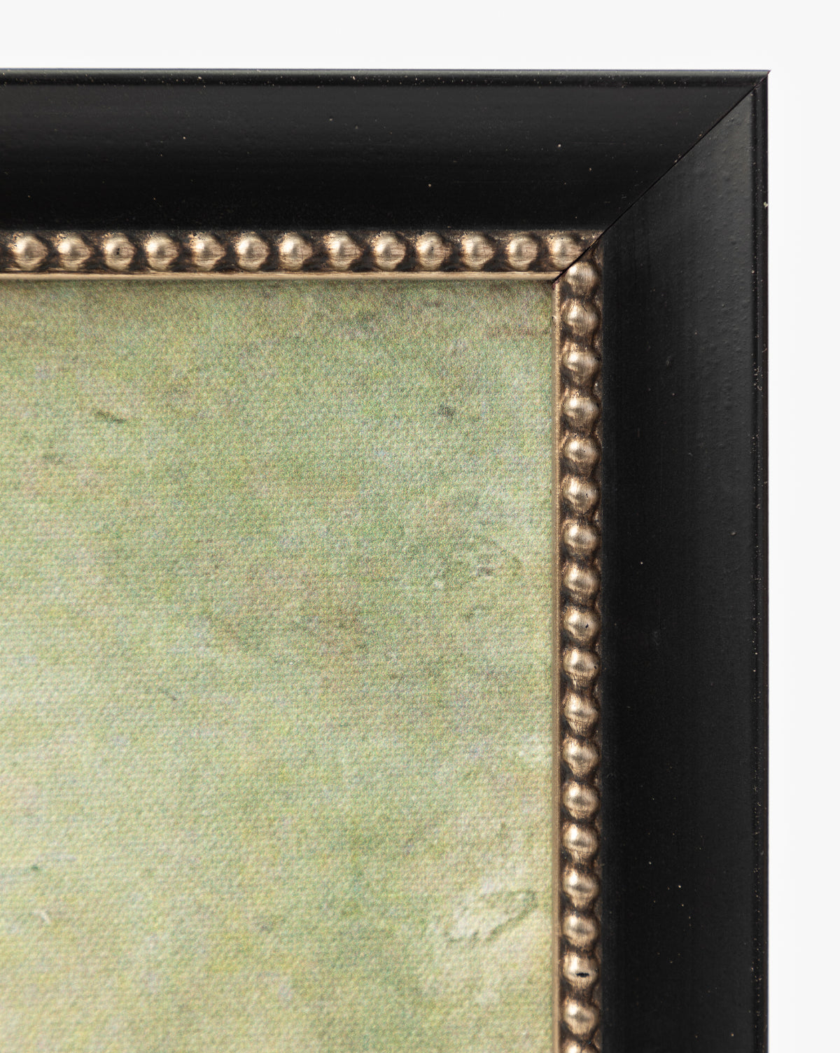 Close-up of the top right corner of the Blowing Brush frame featuring a black outer edge, decorative gold beaded inner border, and textured green background—ideal for showcasing your favorite giclee print, by McGee & Co.