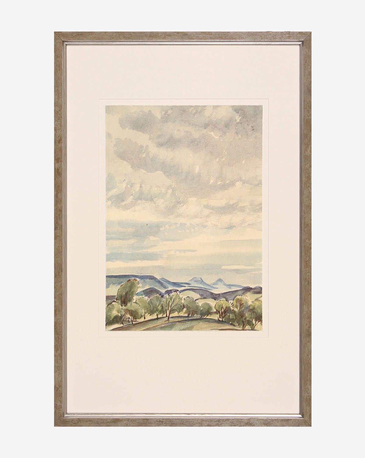 Blue Sky & Trees: Framed watercolor art featuring a whimsical landscape with rolling hills, distant mountains, scattered trees, and textured clouds. Comes with a light mat and silver-finished wood frame.