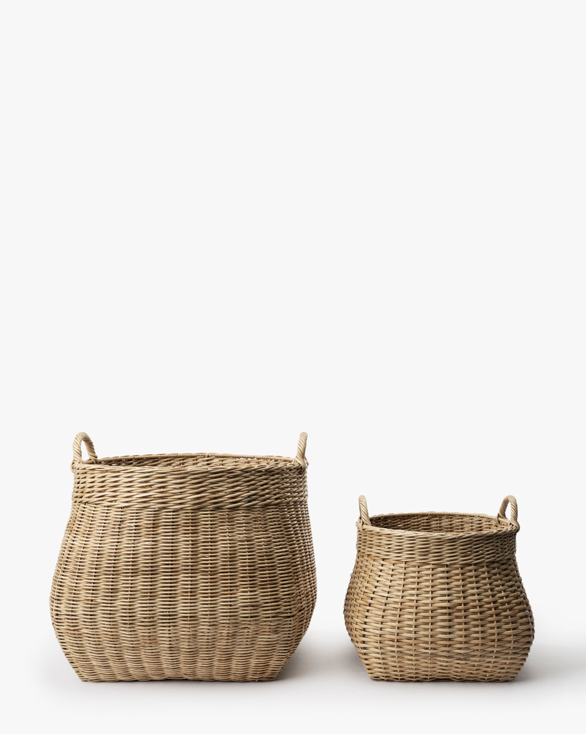 Two Boyce Woven Baskets with handles, one large and one small, are placed side by side on a plain white background by McGee & Co.