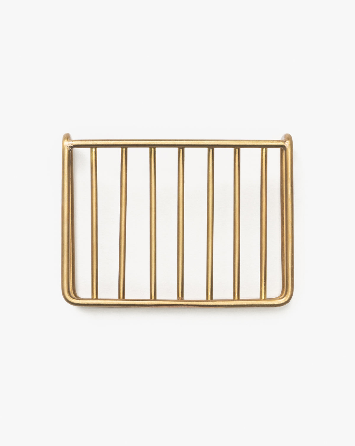 The Brass Soap Dish features a rectangular, brass-finished metal design with a grid of horizontal and vertical bars, ideal for bathroom countertops. Shown on a plain white background.