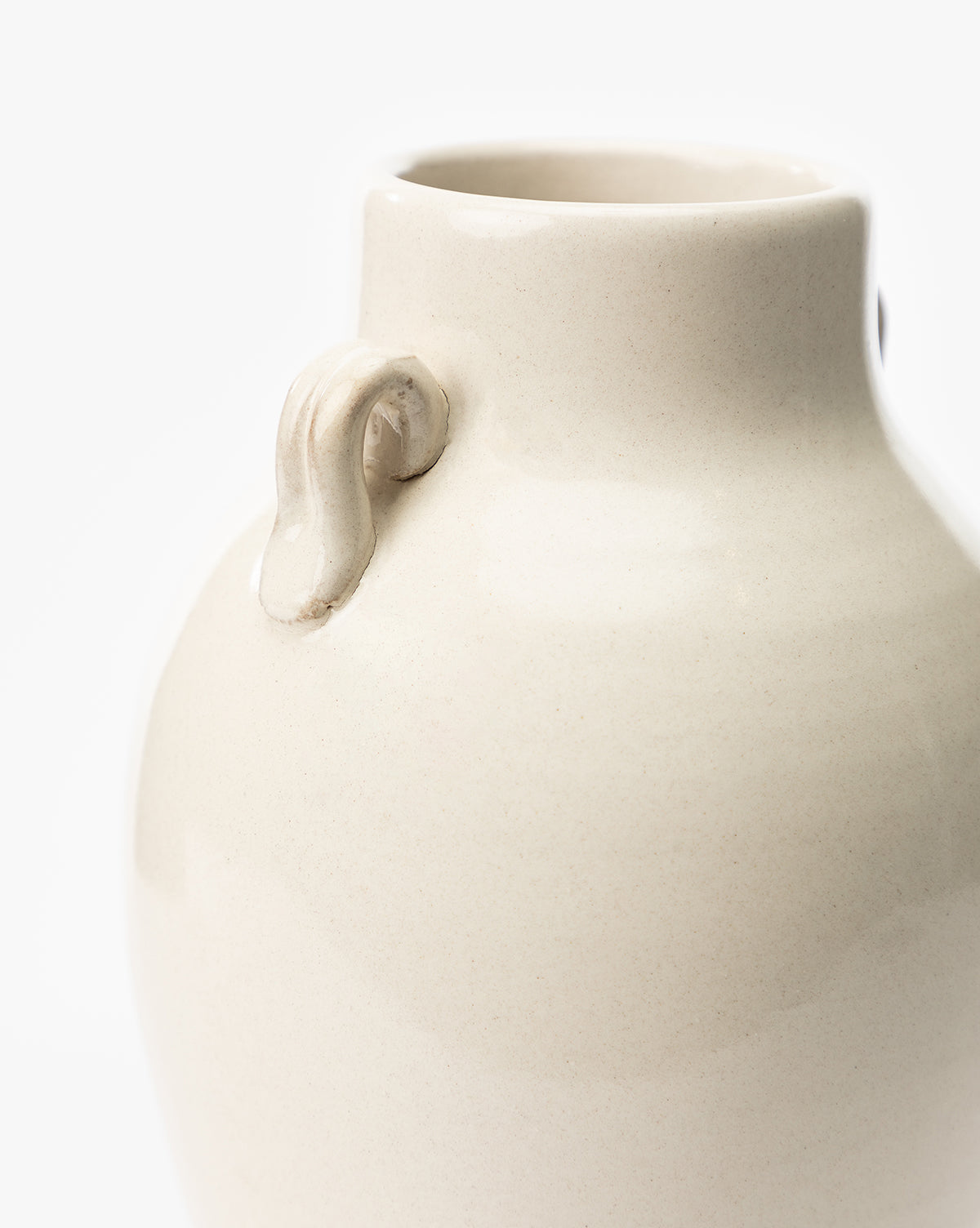 Close-up of the Brinkerhoff Two Handled Vase, cream-colored with small handles on its neck, set against a plain white background, by McGee & Co.