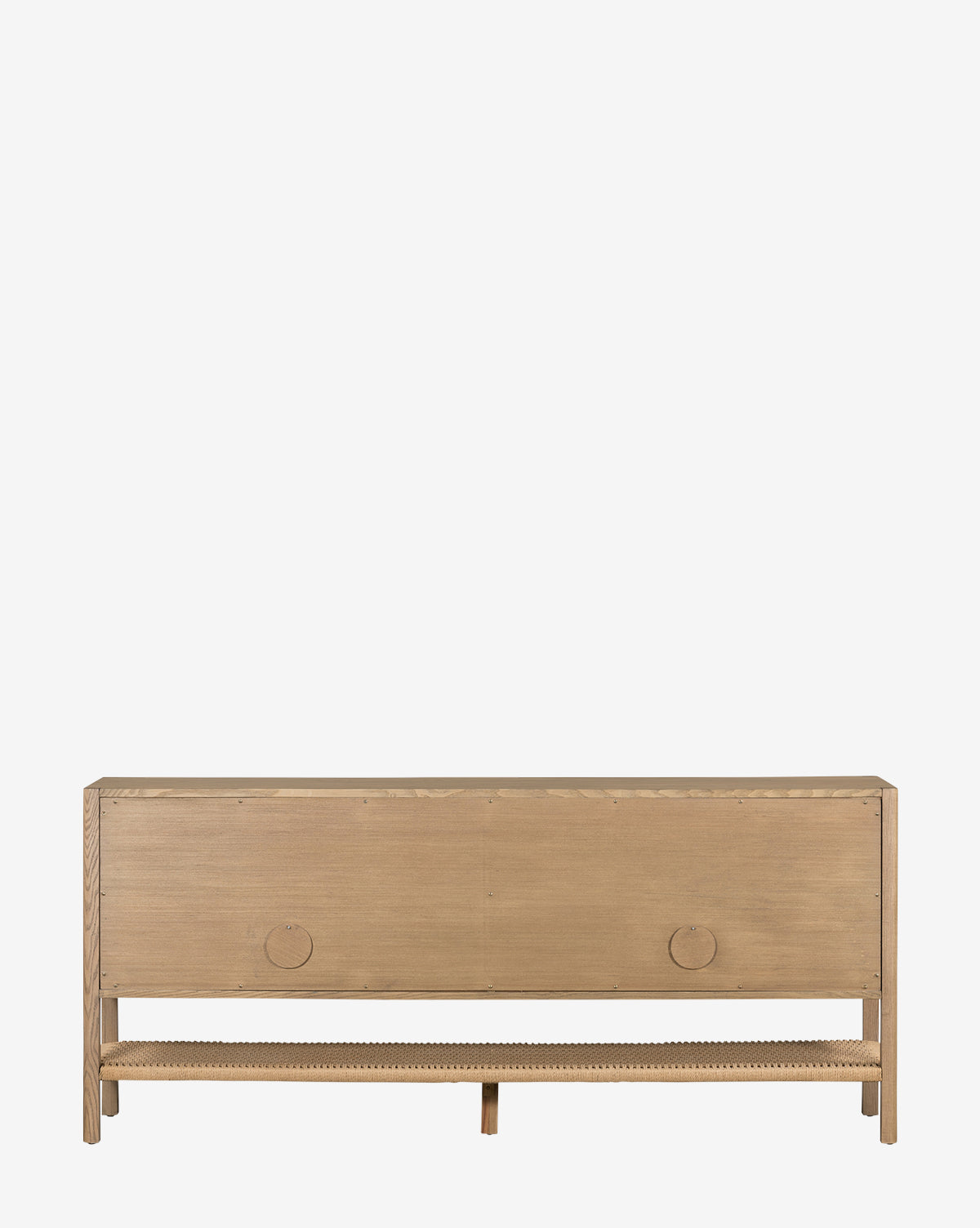The Brio Sideboard showcases Danish design in a minimalist silhouette, crafted from solid ash. It features two circular handles on the front panel and an open shelf below, all set against a plain white background by McGee & Co.