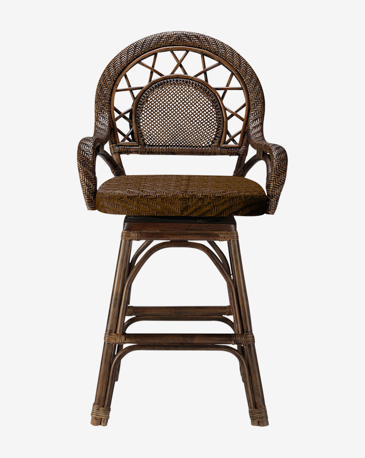 The Brodie Counter Stool by Made Goods showcases a vintage-inspired style with a handwoven rattan seat, curved backrest, rounded arms, cushioned seat, and swivel base with four wicker legs and a footrest. McGee & Co.