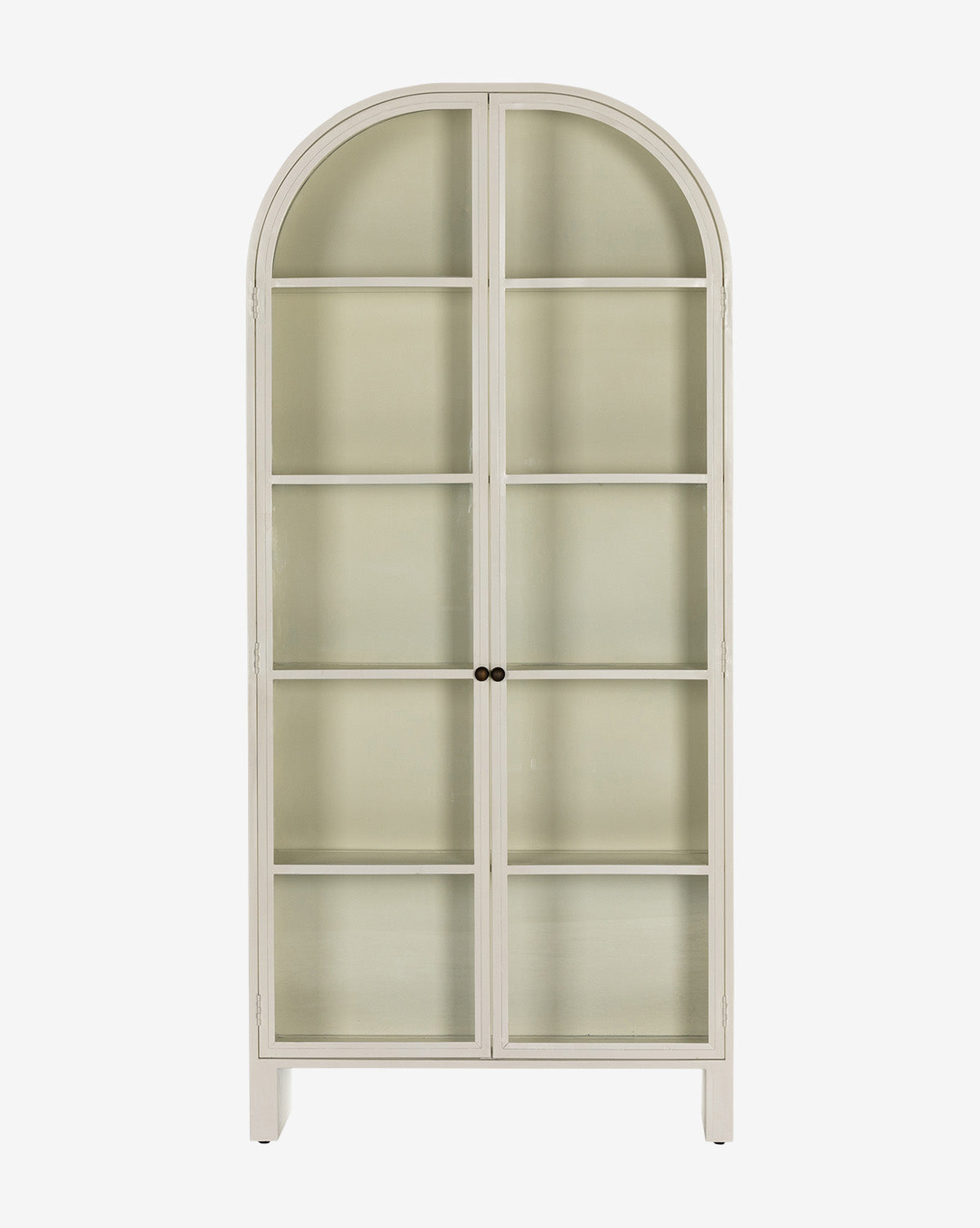 The Brookes Cabinet is tall and light-colored, featuring a rounded arch top, glass doors with two small round center handles, and four interior shelves for a refined look, by McGee & Co.