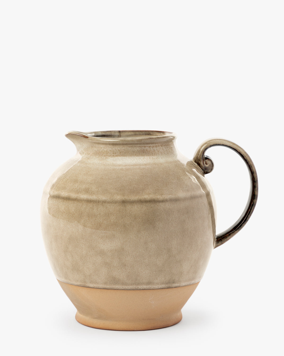 The Brown Stoneware Pitcher features a round shape, small spout, single curved handle, and a slightly matte beige finish. Its unglazed base reveals natural clay—ideal for kitchen styling against a plain white background, by McGee & Co.