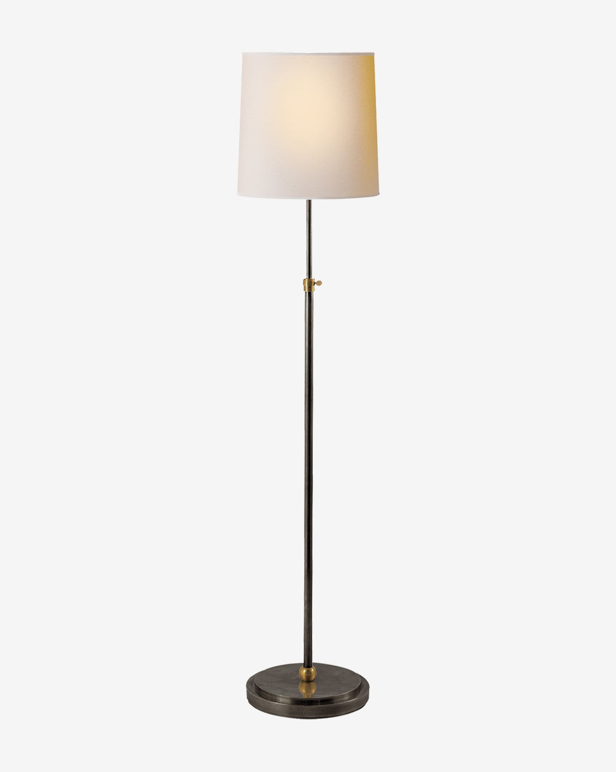 The Bryant Floor Lamp boasts a modern round black base, slim metal pole, and soft white linen shade, casting gentle light—a classic addition to any space, by McGee & Co.