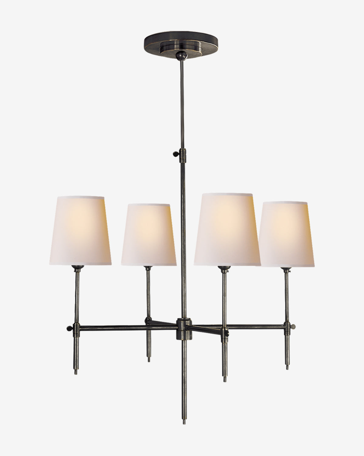 The Bryant Small Chandelier by Visual Comfort & Co. Signature features a dark metal frame and four tapered linen shades in a row, suspended from the ceiling by a central rod—McGee & Co.
