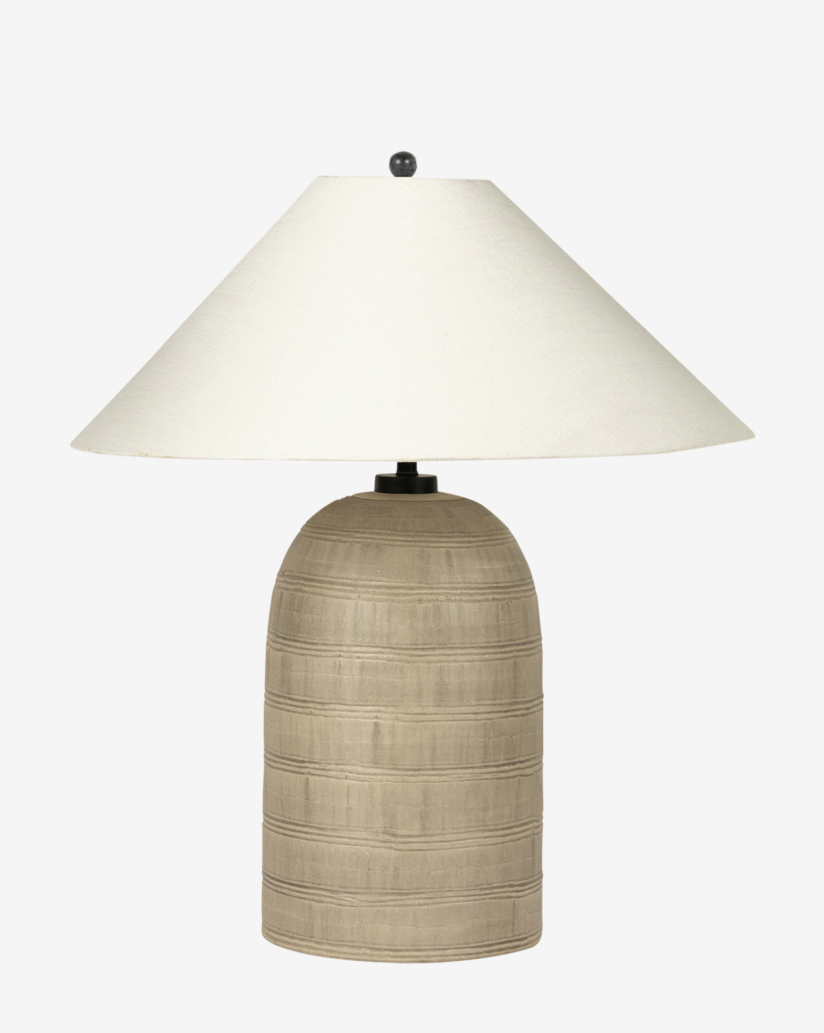 The Brynner Table Lamp has a textured, rounded beige base and a wide, off-white conical shade—an elegant addition to transitional decor, by McGee & Co. Shown against a white background, by McGee & Co.