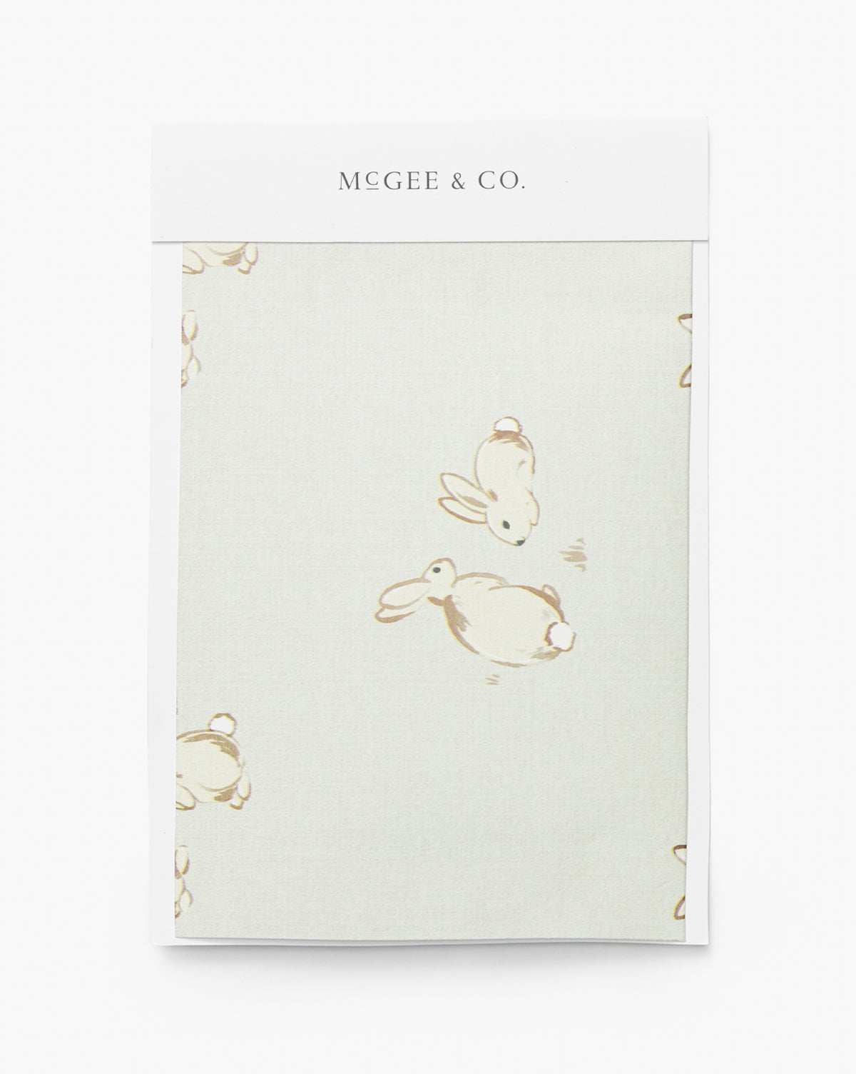 The Bunnies Wallpaper Swatch by York Wallcoverings features a light background with simple, light brown line drawings of rabbits in various poses, creating a playful pattern. McGee & Co.