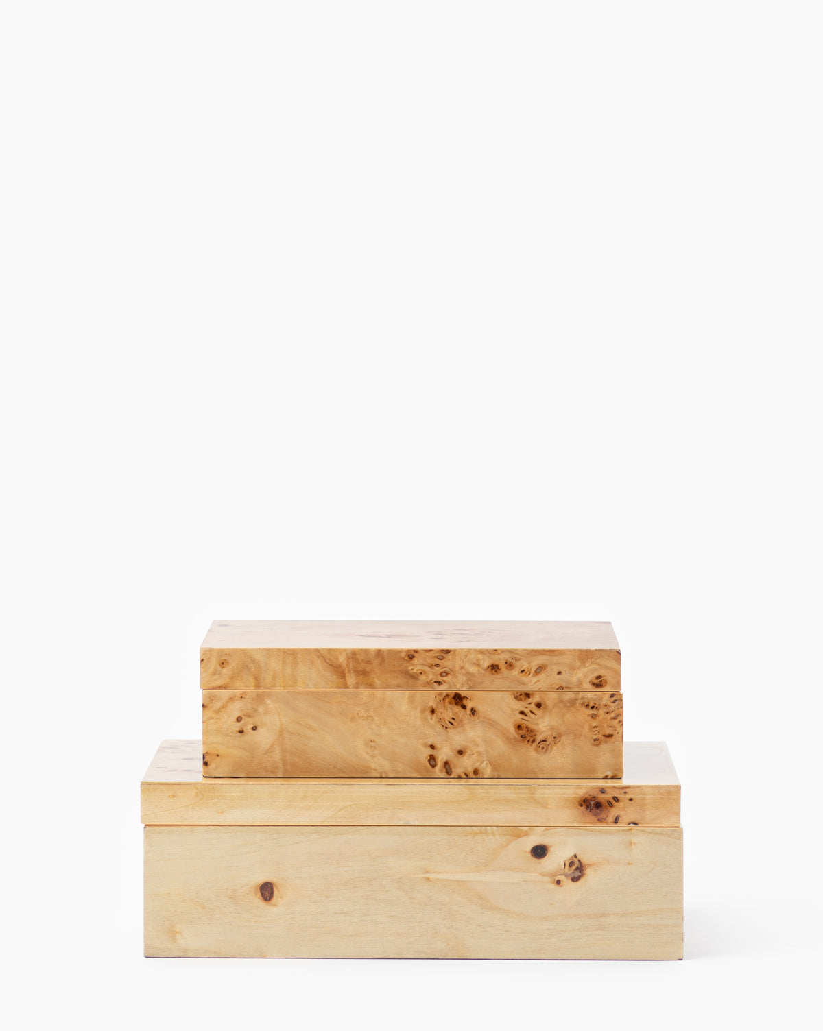 Two Burl Wood Boxes with lids, featuring natural knots and grain patterns, are stacked on a plain white background, adding contemporary elegance.