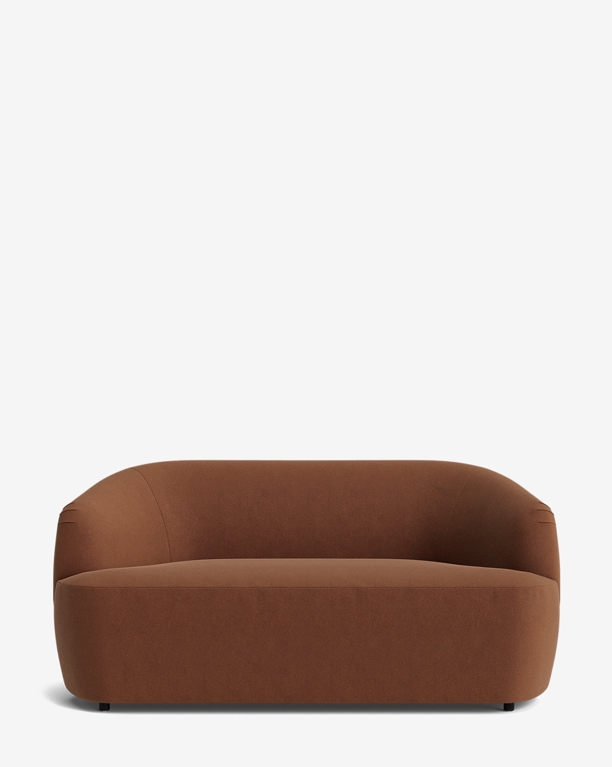 The Byron Settee 68 is a modern, minimalist brown settee with a low curved back and wide seat, upholstered in smooth fabric, shown against a plain white background by McGee & Co.