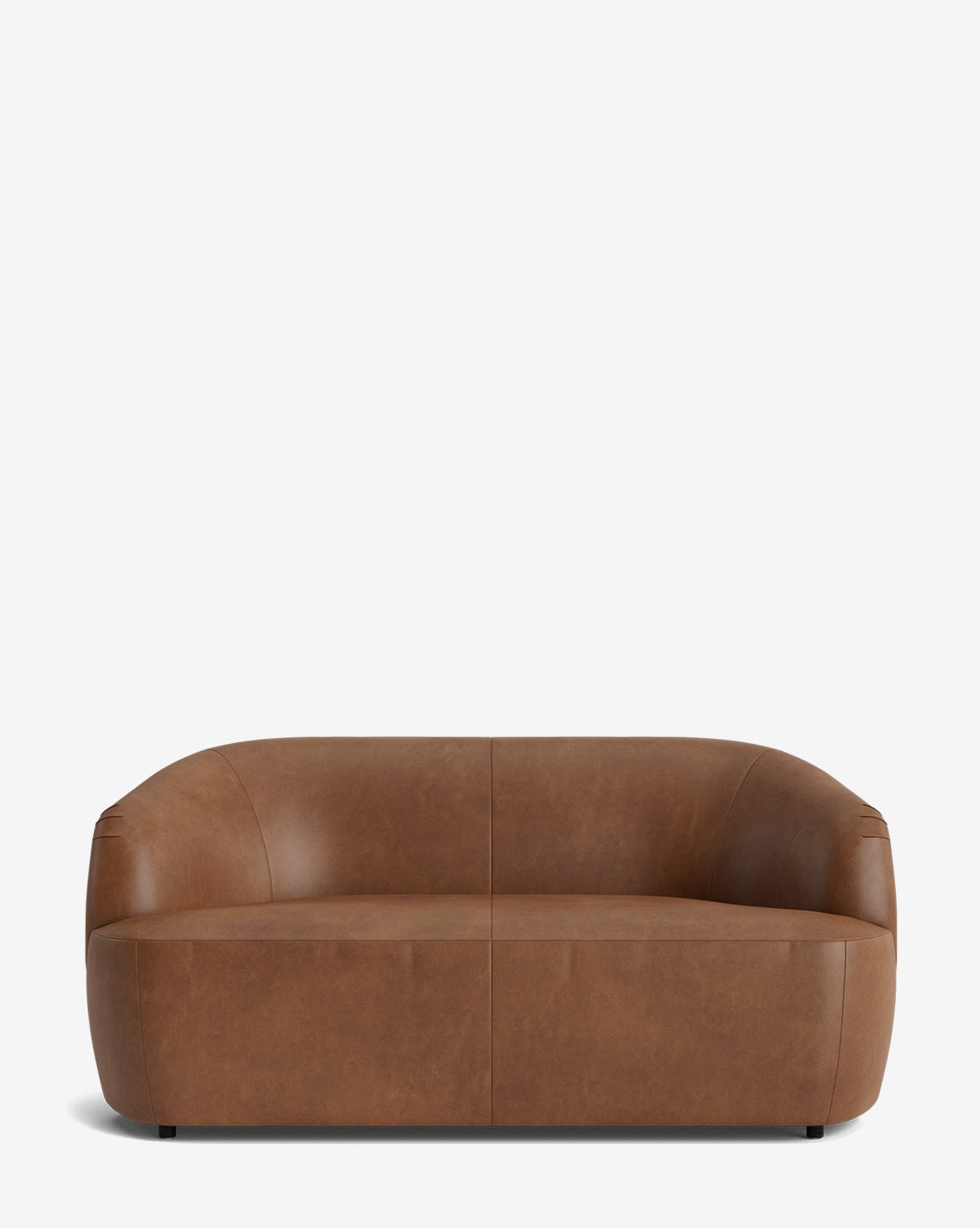 The Byron Settee 68 in brown leather showcases a low, curved back and armrests with smooth surfaces and a minimalist design, all set against a plain white background, by McGee & Co.