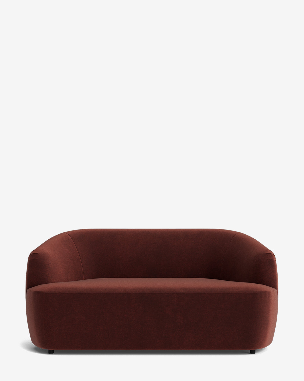 The Byron Settee 68 is a modern, minimalist piece with a low, curved backrest and rounded edges, upholstered in dark brown fabric and shown against a white background by McGee & Co.