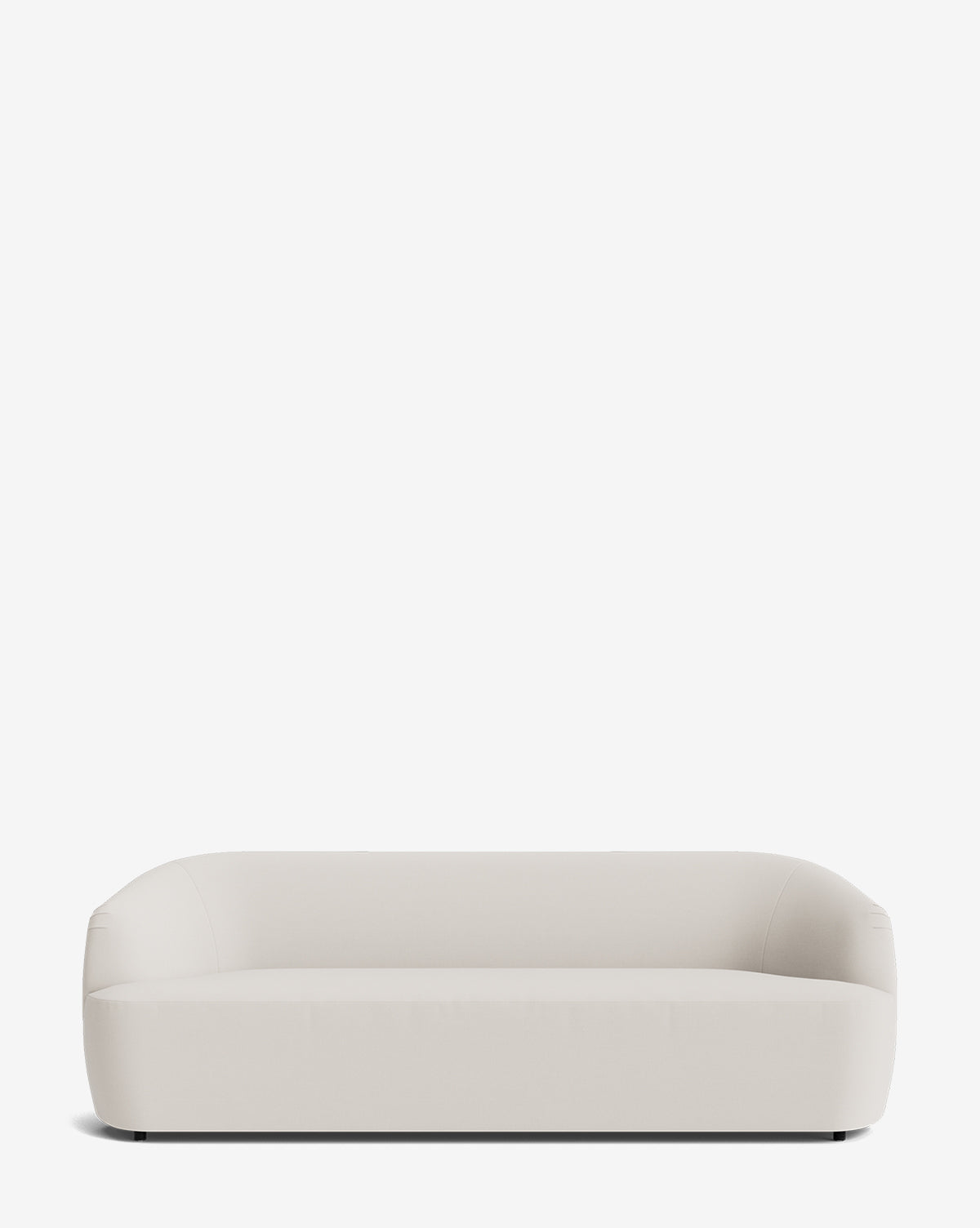 The Byron Sofa 96 features a modern, minimalist design with rounded edges and a low back, shown against a plain white background by McGee & Co.