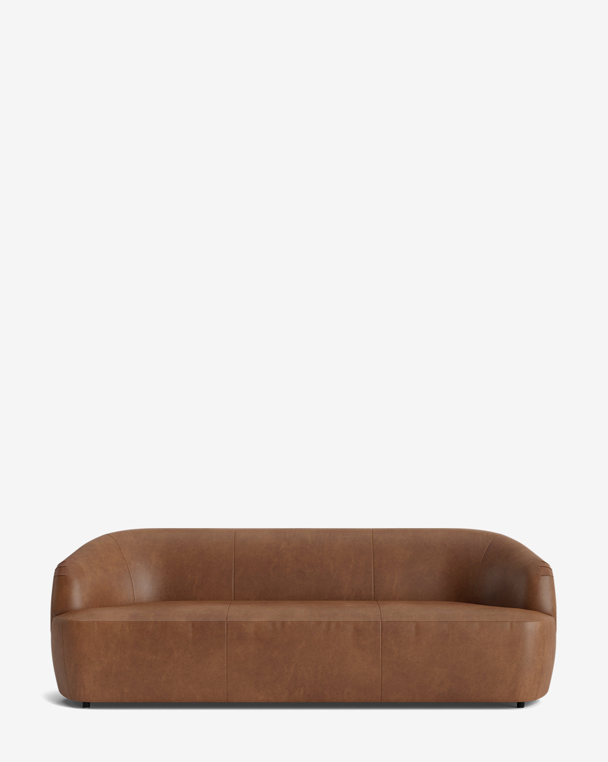 The Byron Sofa 96 in brown leather showcases a modern, low-profile design with a curved back and rounded edges, set against a plain white background, by McGee & Co.