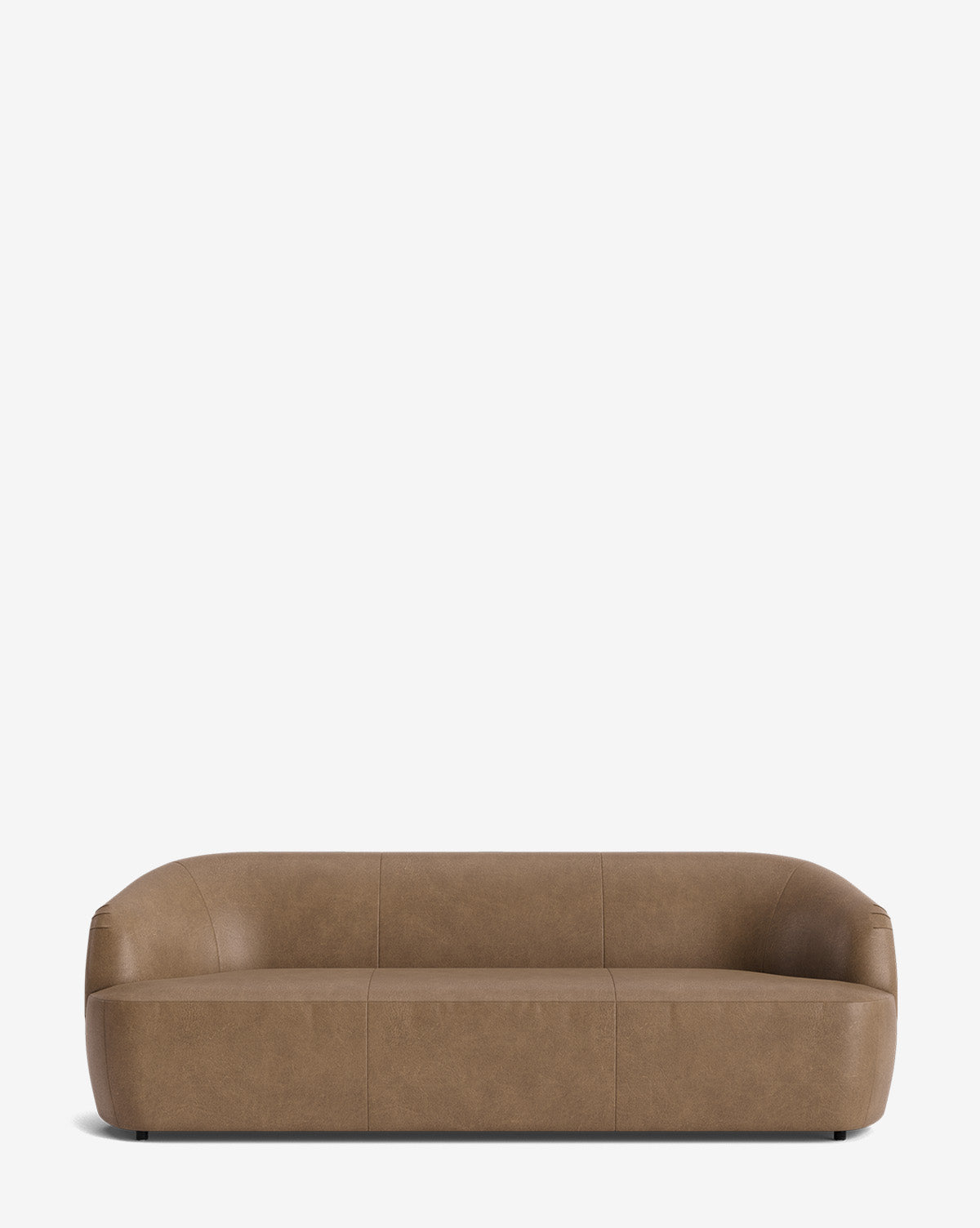 The Byron Sofa 96 in brown leather has a modern, minimalist look with a low profile, curved back, rounded edges, and hidden legs, shown against a plain white background by McGee & Co.