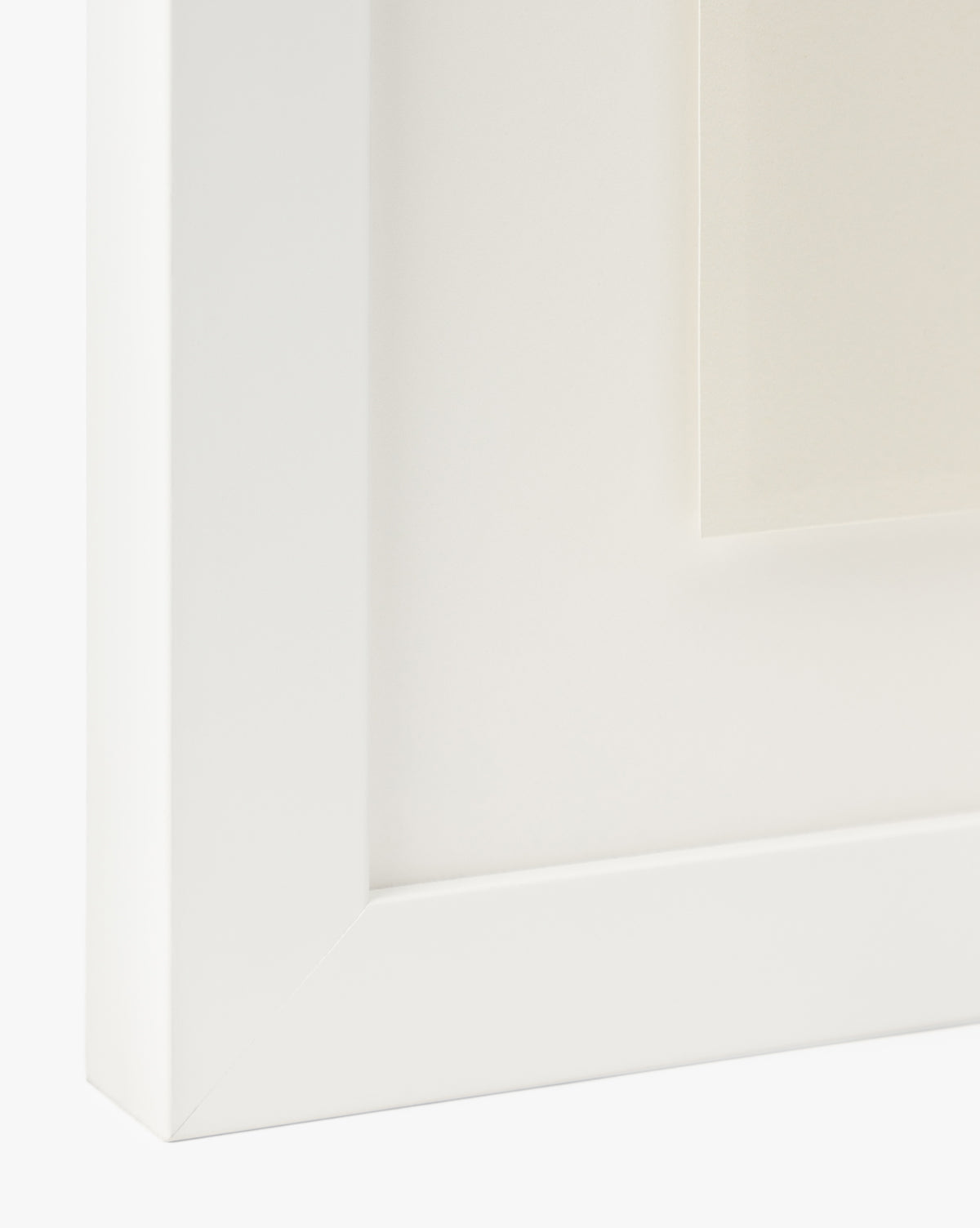 Close-up of the bottom left corner of a white wood frame with a white mat, highlighting part of the C’est La Vie giclee print—an ideal choice for timeless decor, by McGee & Co.