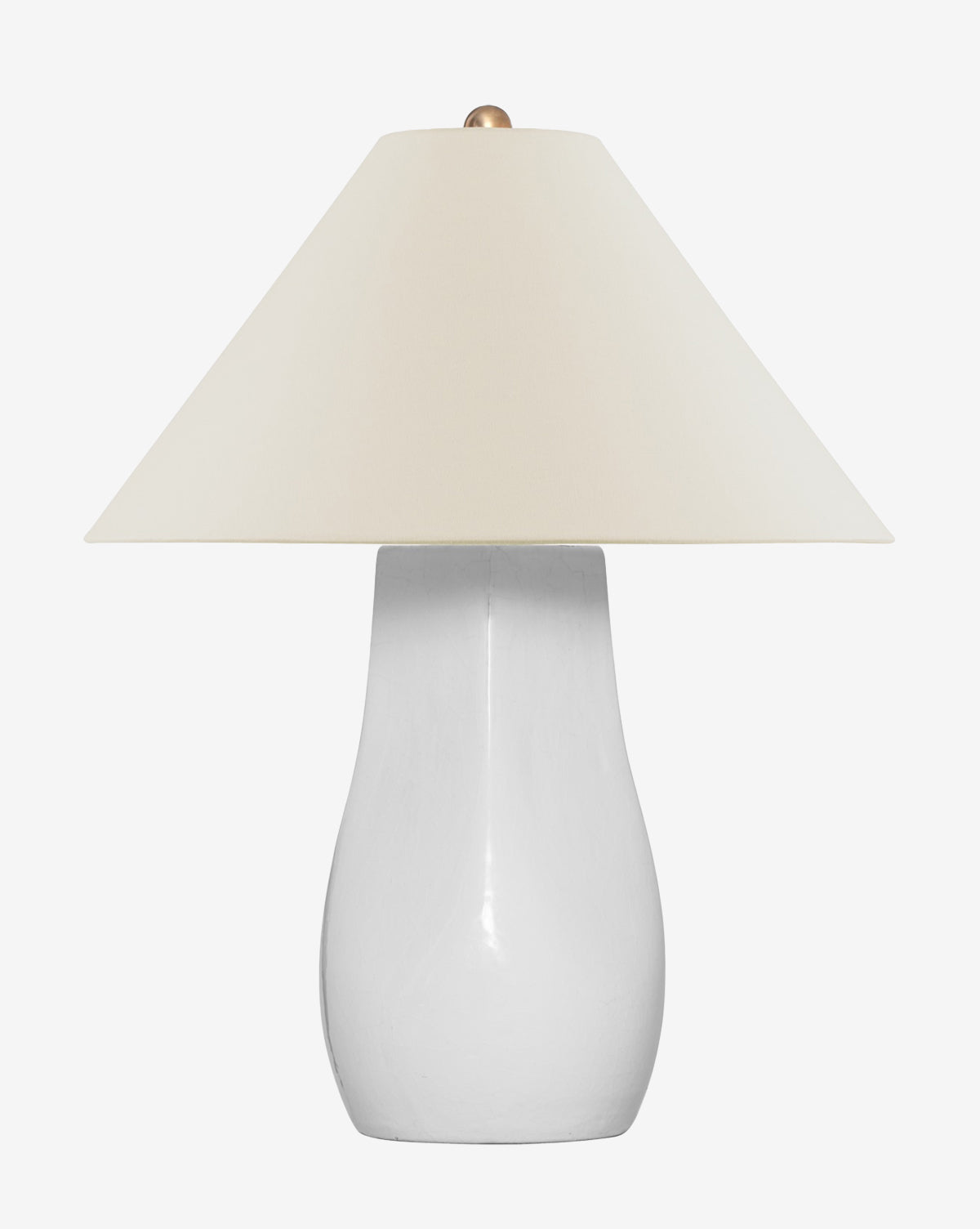 The Cabazon Table Lamp showcases a smooth white ceramic base paired with a wide white linen shade, creating a modern organic look against a plain white background, by McGee & Co.