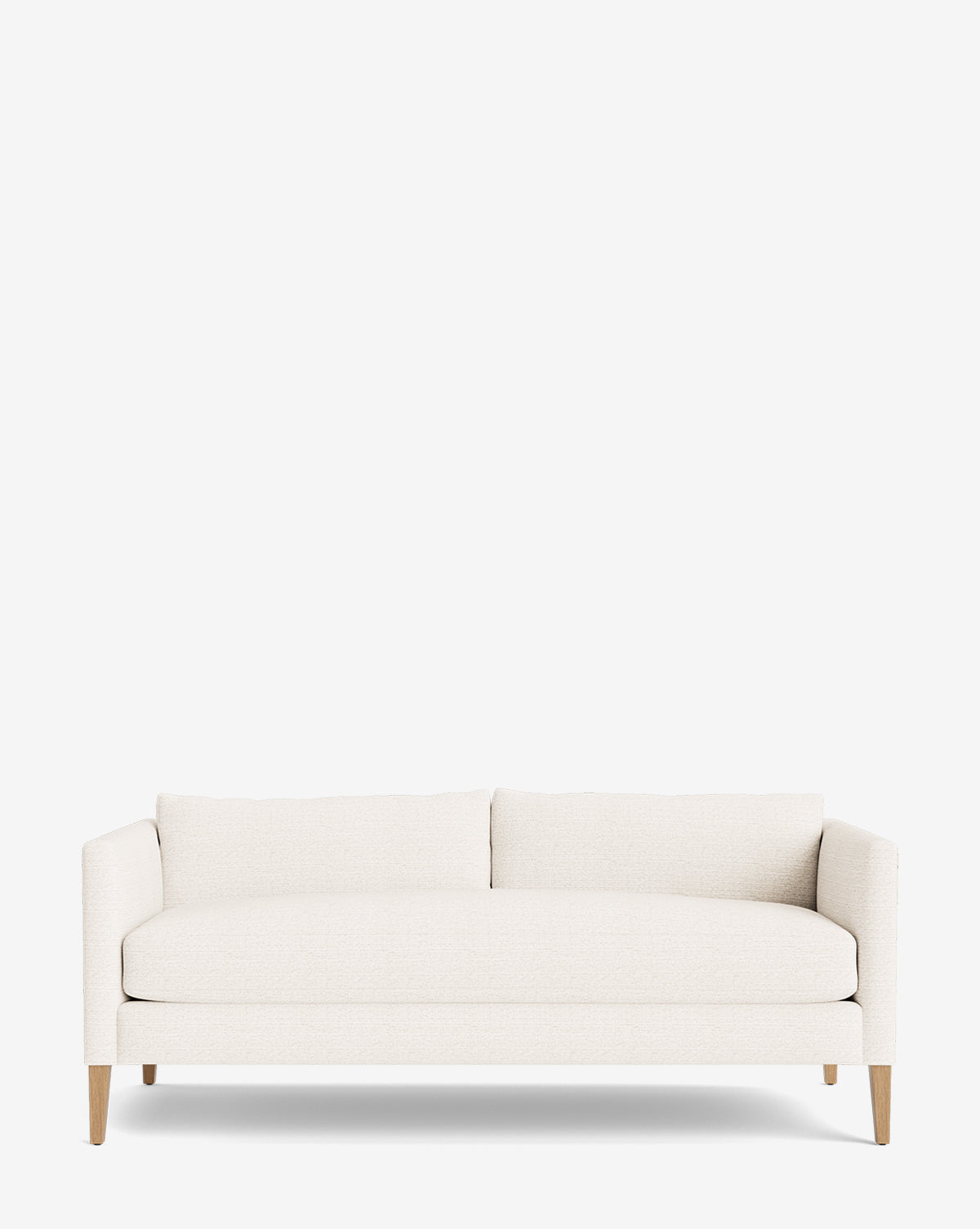 The Cade Sofa 80 is a modern, white upholstered sofa featuring down-wrapped cushions, clean lines, two seat cushions, and light wooden legs, shown against a plain white background by McGee & Co.