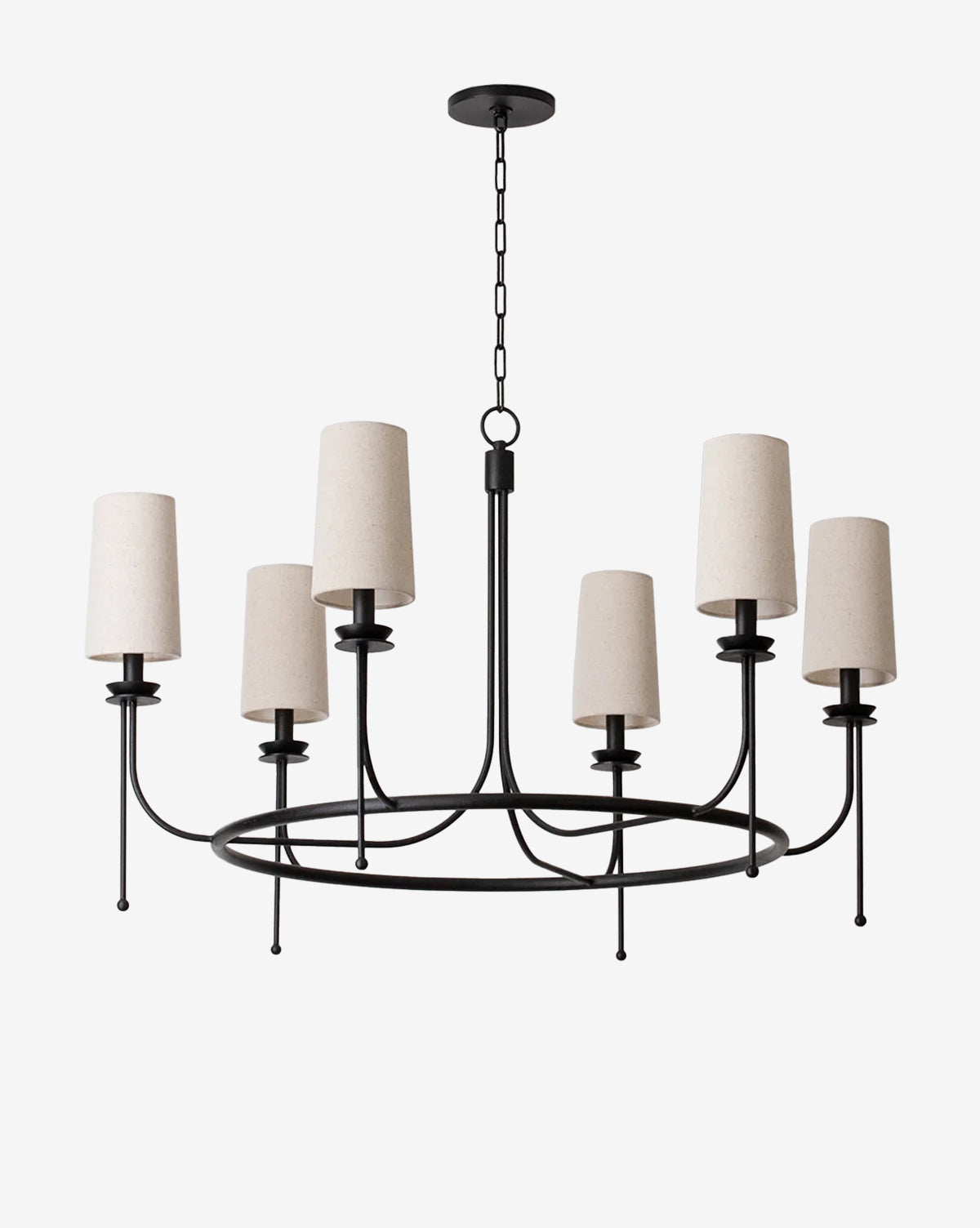 The Calder Chandelier by Troy Lighting is a modern black metal fixture with eight arms and natural linen shades, hanging from a chain against a plain white background. McGee & Co.
