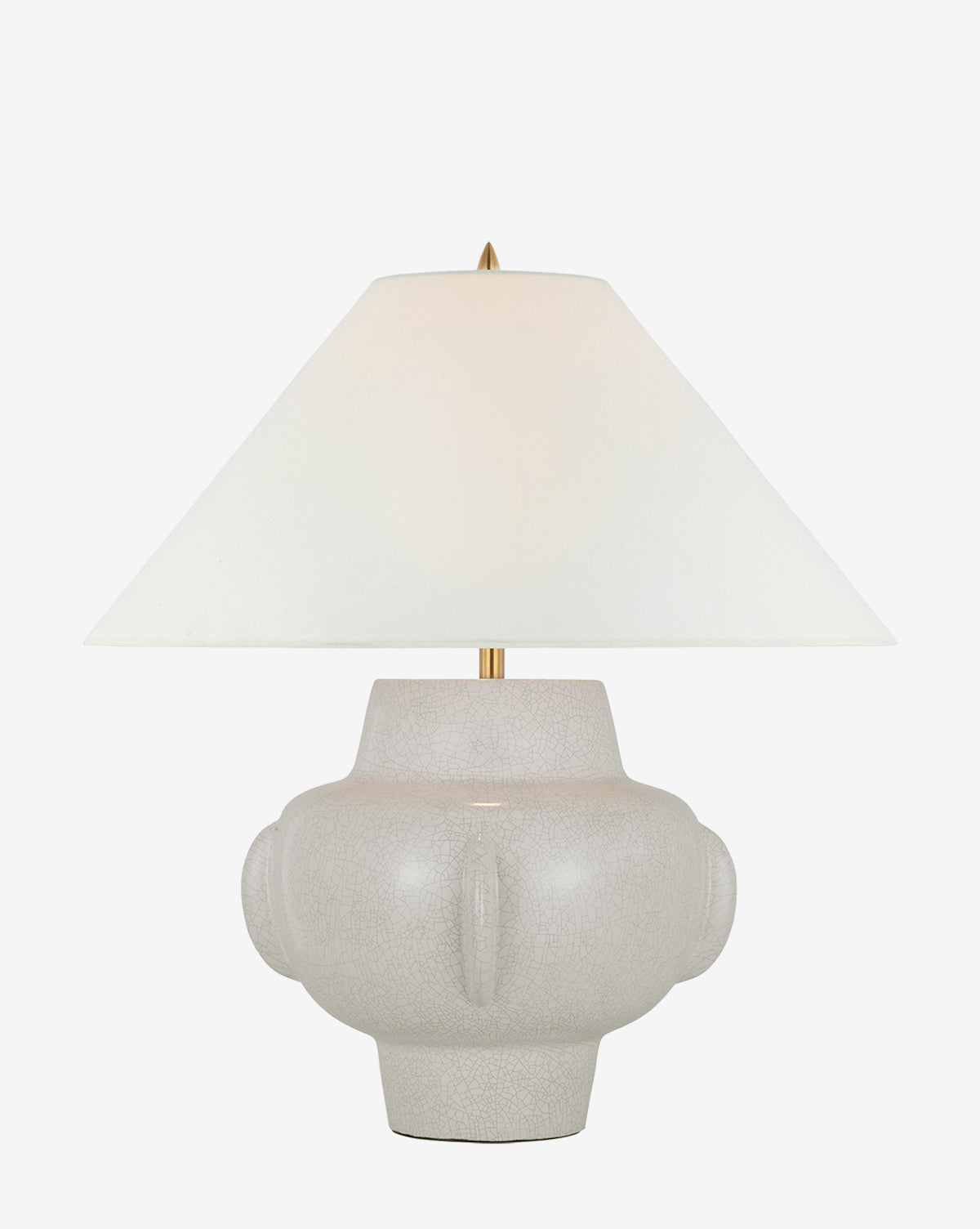 The Cap-Ferrat Table Lamp by Visual Comfort & Co. Signature showcases a wide white linen shade and a light gray, textured round ceramic base with symmetrical raised side details for extra charm. McGee & Co.