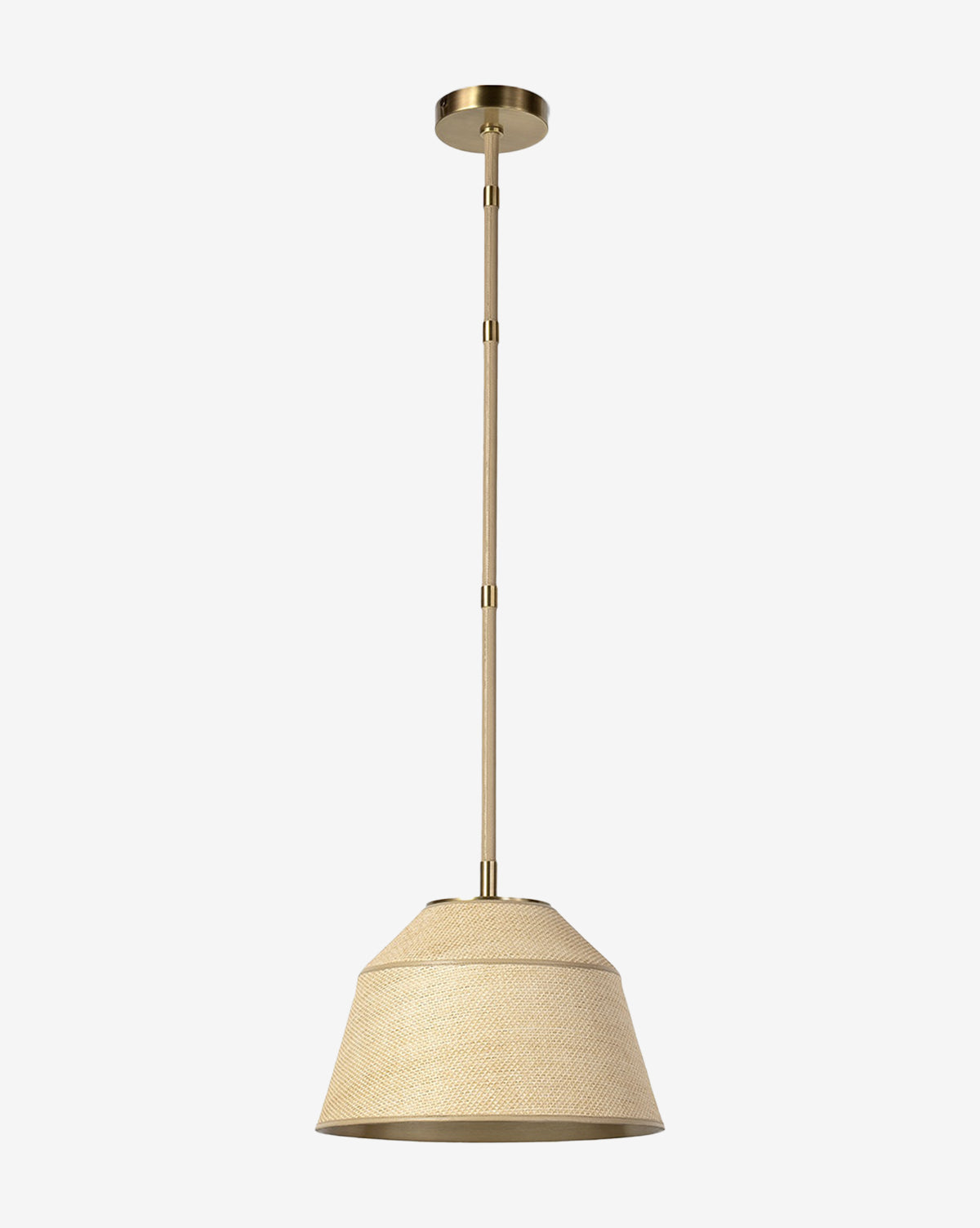 The Capistrano Pendant features a beige raffia shade with brass accents and is suspended from the ceiling by a matching brass rod, shown against a plain white background, by McGee & Co.