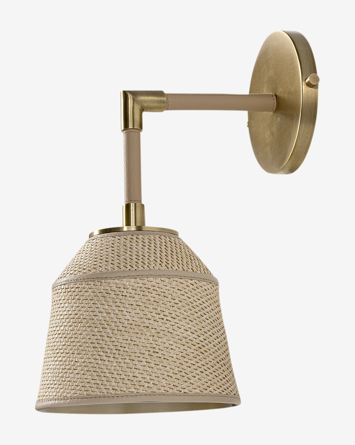 The Capistrano Sconce by Palecek features a brass wall mount, angled leather-wrapped arm, and woven rattan shade, blending modern style with natural warmth for an inviting look. McGee & Co.