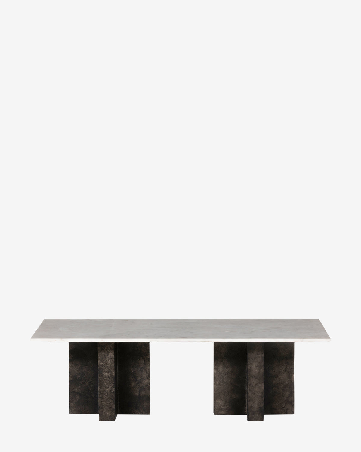 The Carrick Coffee Table showcases a smooth, pale marble top with four dark, textured pedestal legs, all set against a plain white background by McGee & Co.