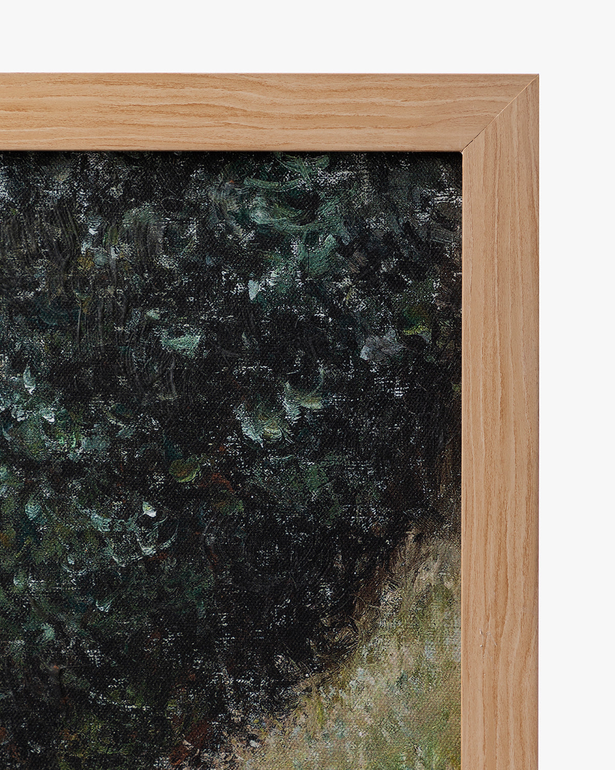 Close-up of the natural oak wood frame around the Carved Path giclee on canvas, highlighting green and black brushstrokes that evoke dense foliage, by McGee & Co.