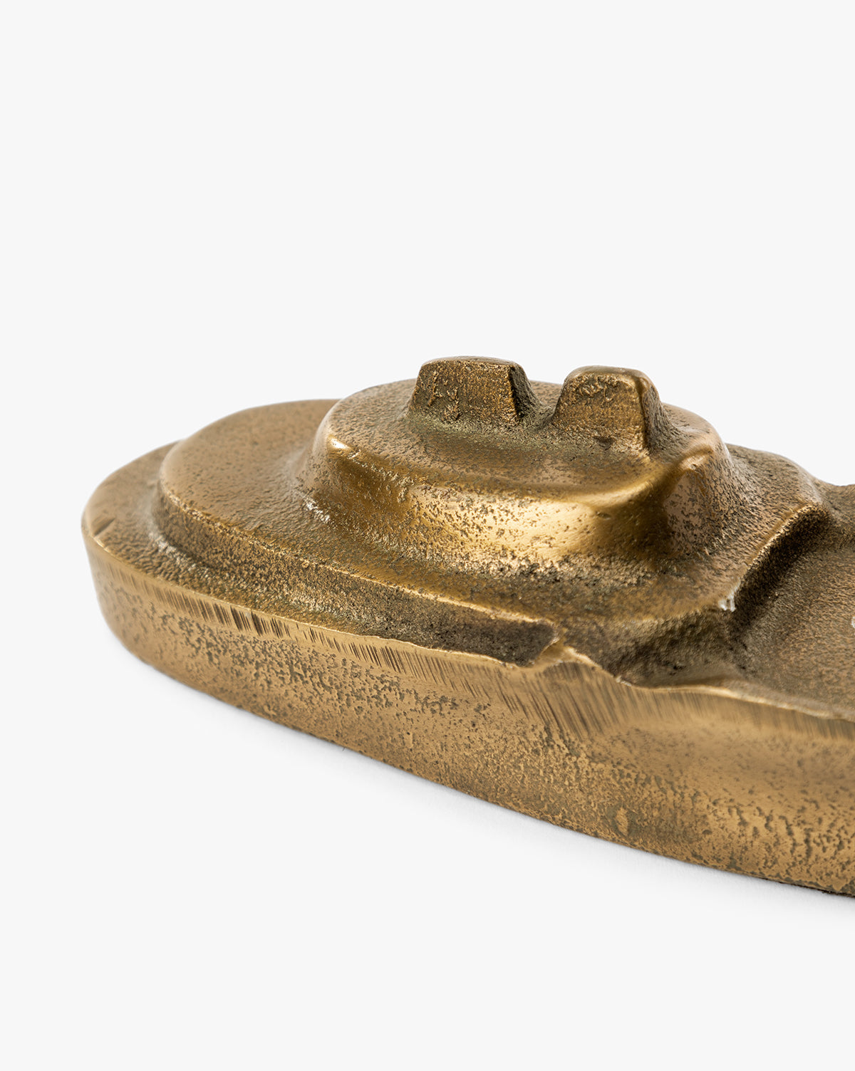 Close-up of the Cast Aluminum Boat Object, showing its textured antique bronze finish and smooth, rounded, layered design inspired by nautical decor, set against a plain white background, by McGee & Co.