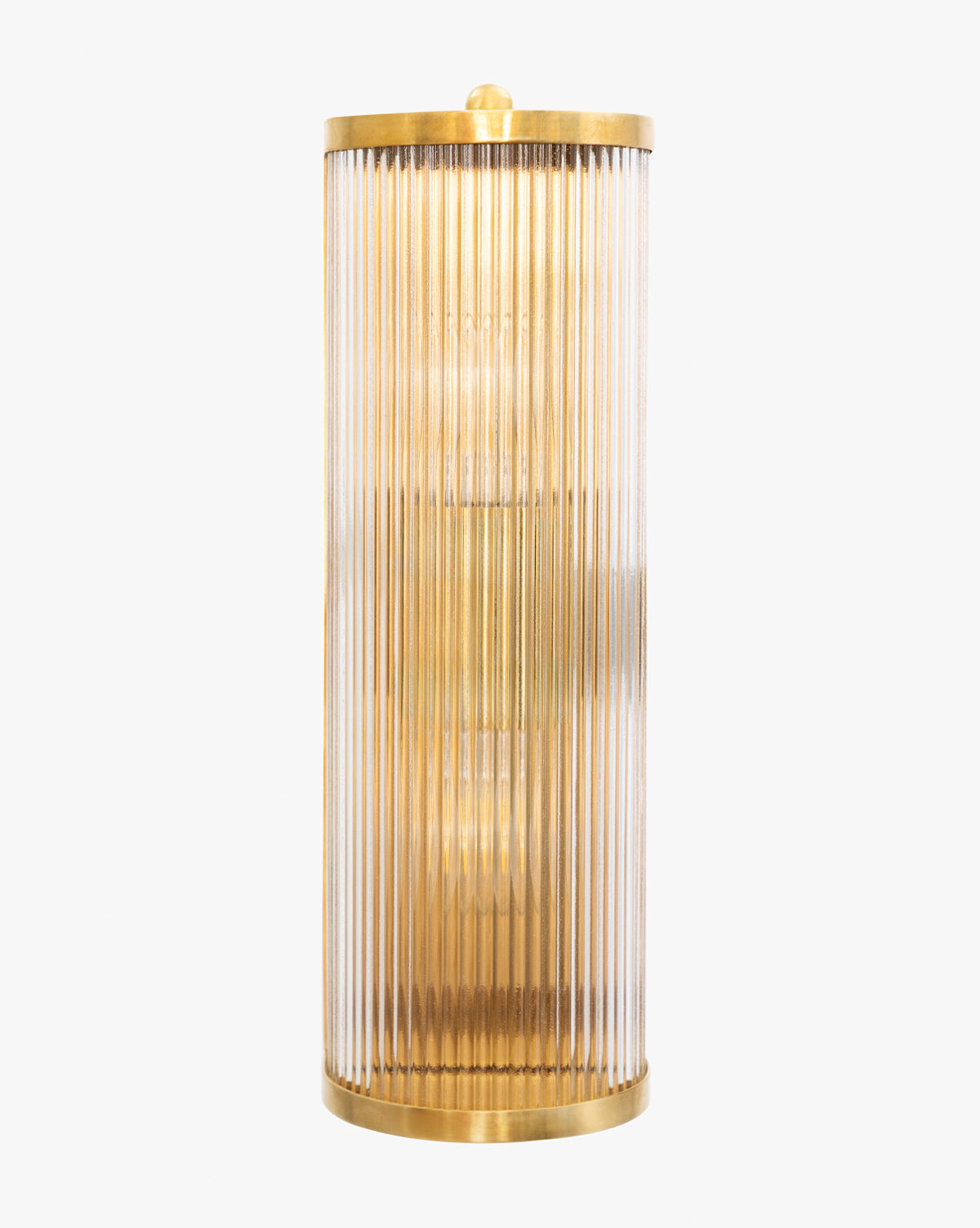 The Cavendish Sconce by Meredith (China) Ltd features an antique brass frame with vertical fluted glass panels, emitting a warm light. McGee & Co.