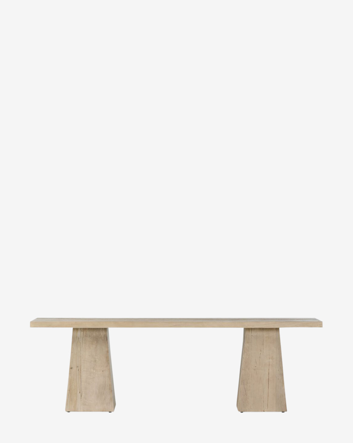 The Chandra Console features a minimalist design with a flat rectangular seat and two wide trapezoidal legs, made from alder wood, shown against a plain white background by McGee & Co.